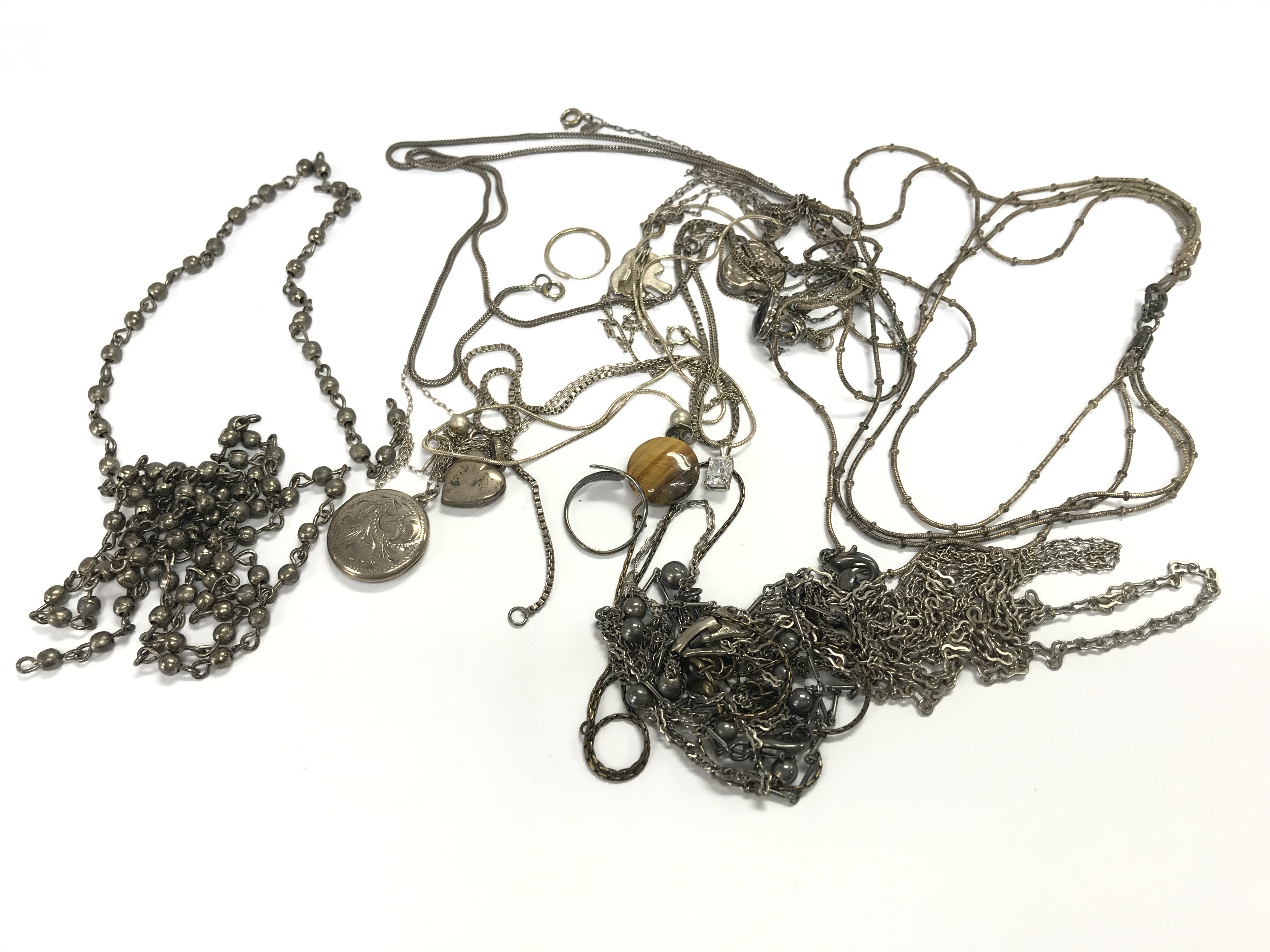 A collection of assorted silver jewellery including chains necklaces rings etc. 111g total.
