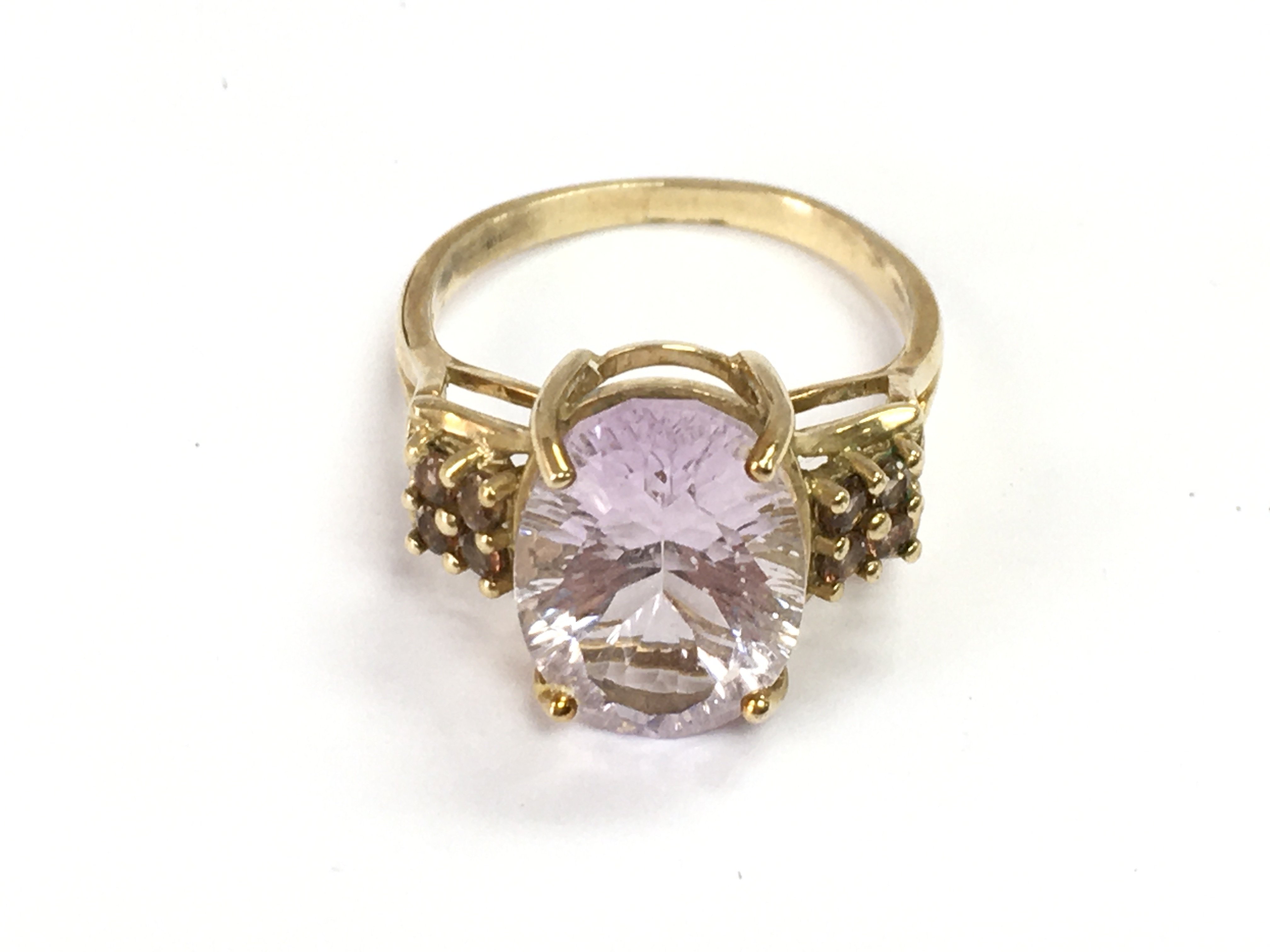 A 9ct gold ring set with a pink gemstone, size P/Q. 4.3g total weight Postage category A
