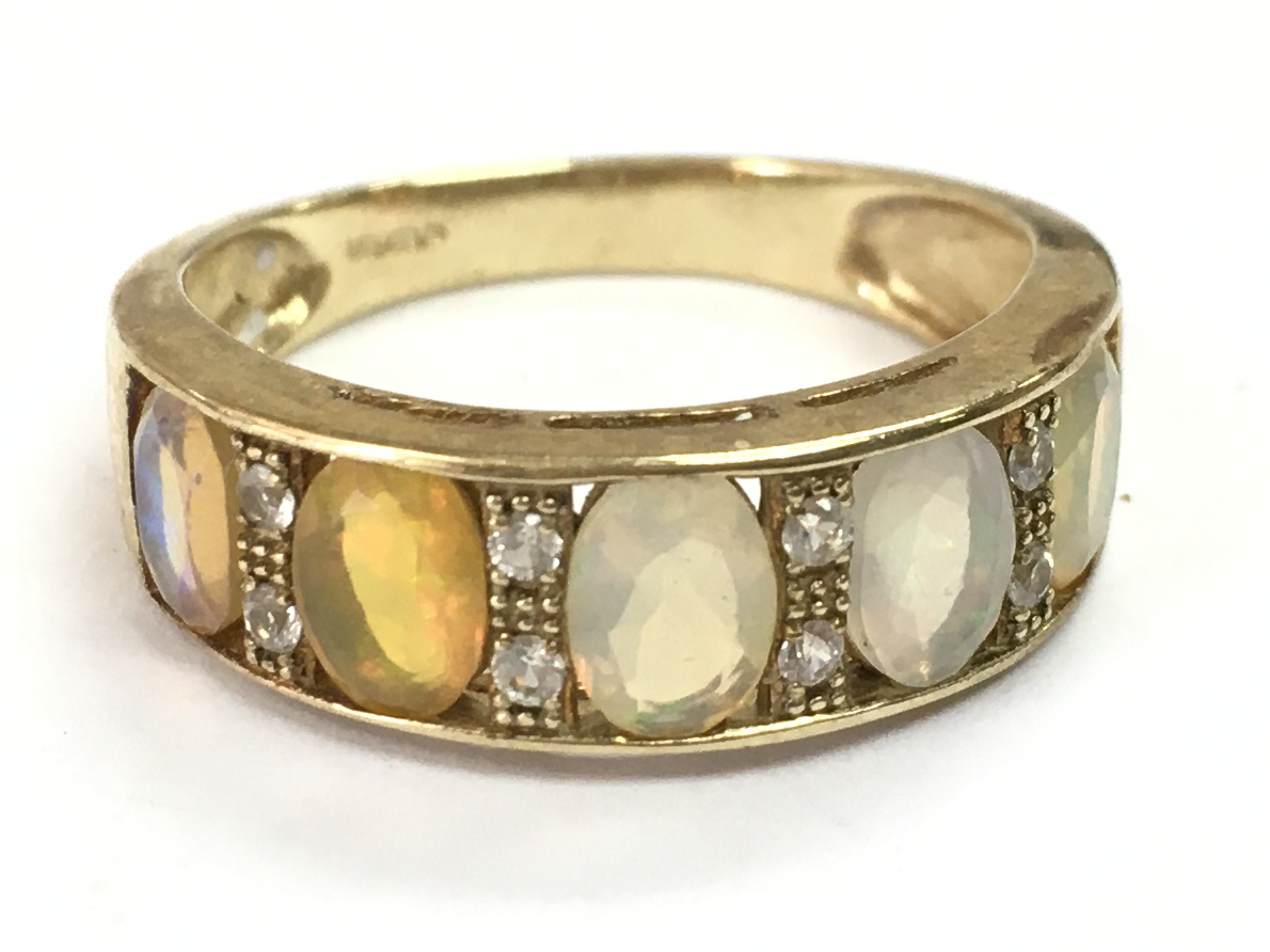 A 9ct gold opal set ring, 3g total weight. P/Q Postage category A