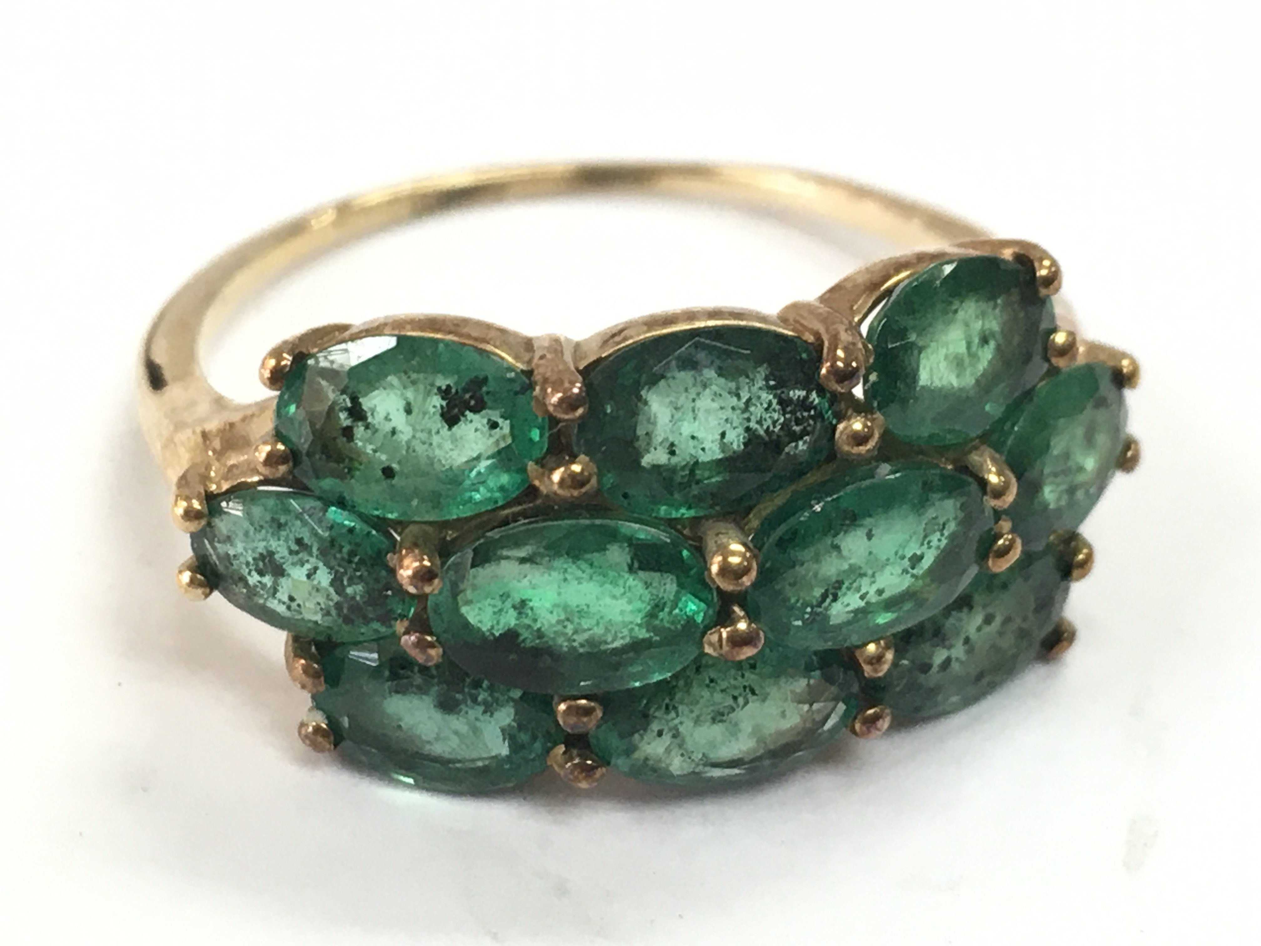 A 9 carat gold green stone ring, 3.1g total weight. Size S . Postage category A