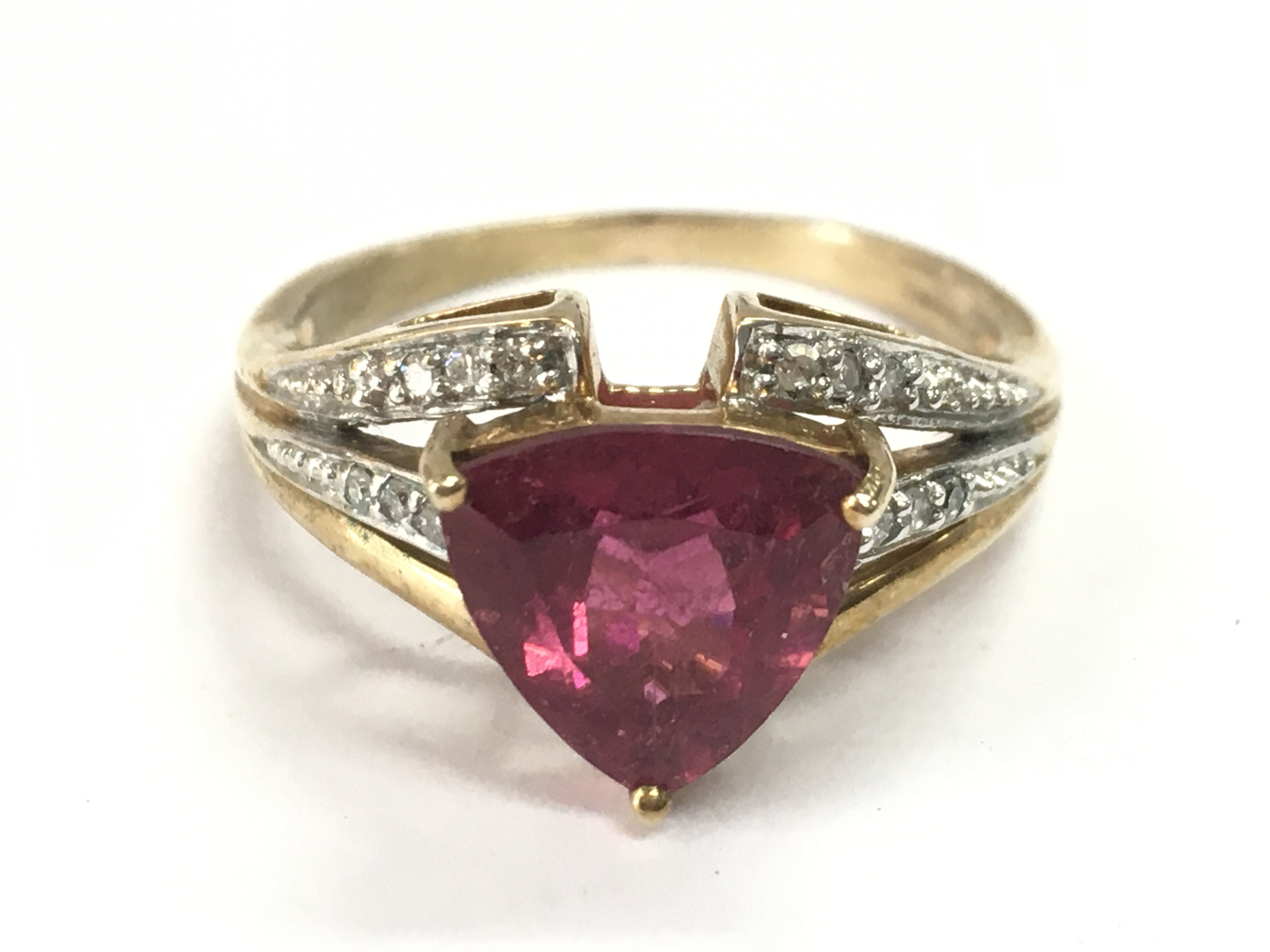 A 9 carat gold ruby and small diamond stone set ring , 3.4g total weight. Postage category A