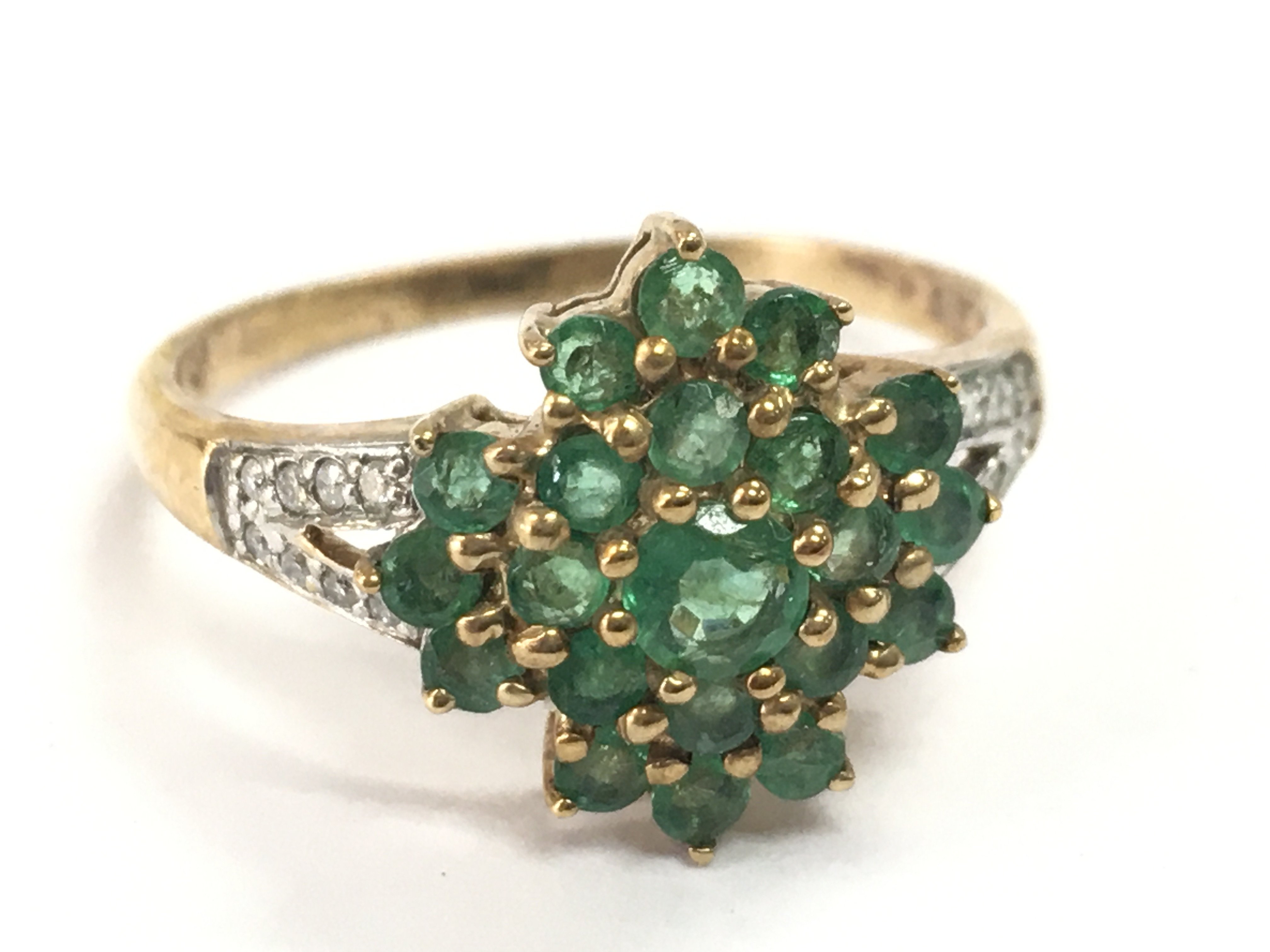 A 9ct gold emerald and diamond shard set ring , 2.5g total weight. Postage category A