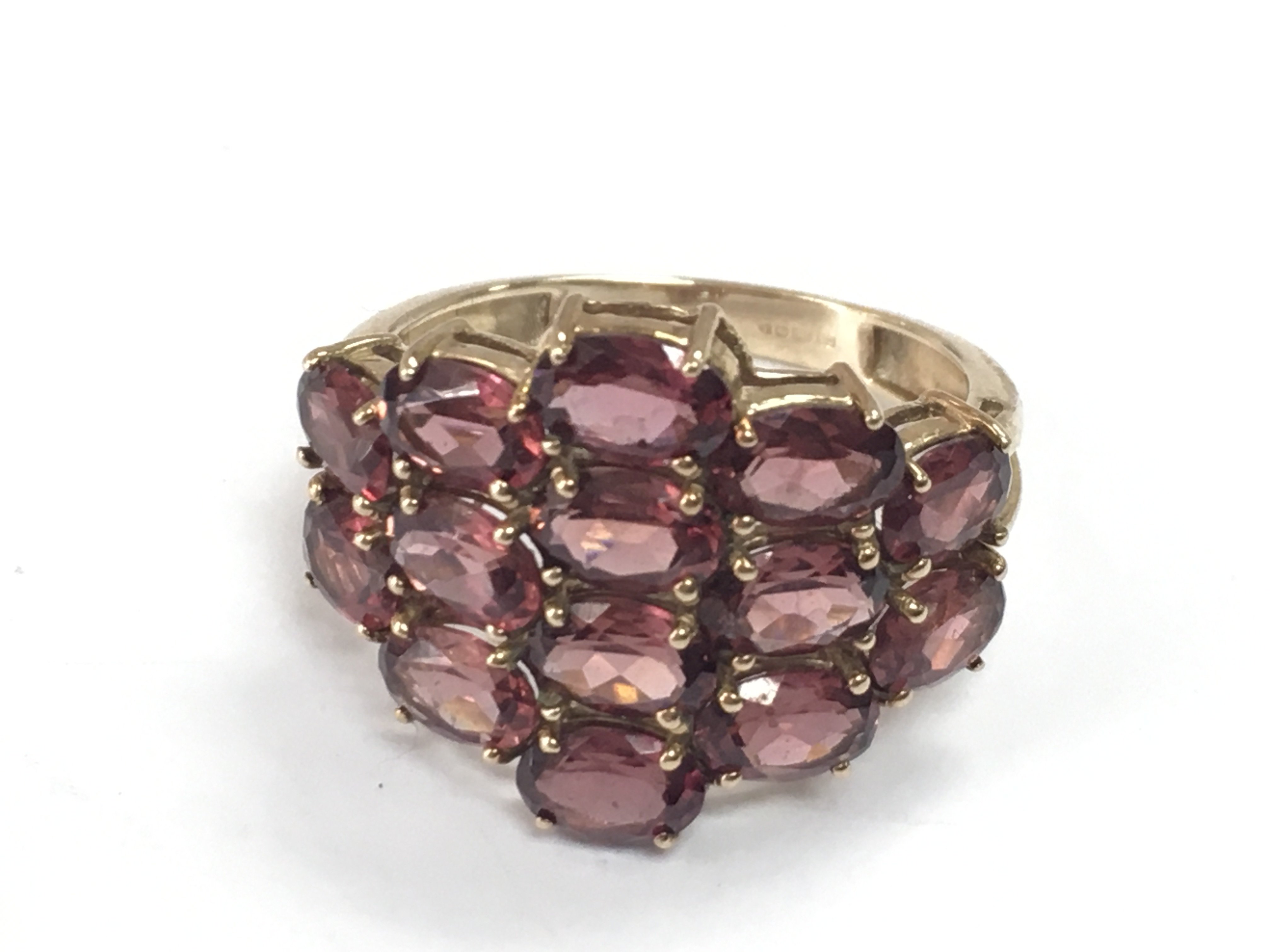 A 9ct gold rhodolite 14 stone ring. Size S . 4.5g total weight Postage category A