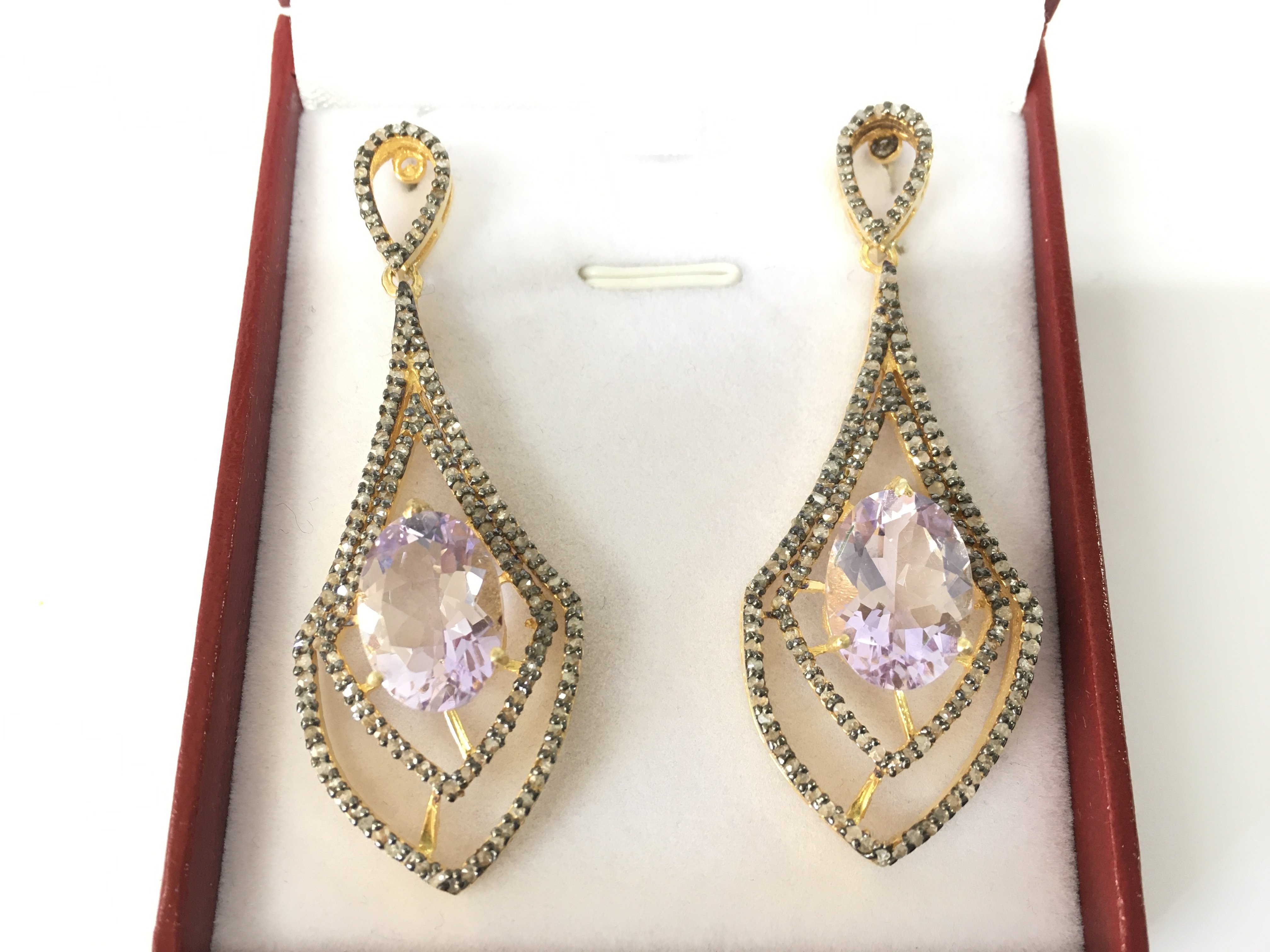 A pair of chandelier style long drop earrings in silver gilt set with oval Kunzite and diamonds. Kunzites 12.00ct approx. Diamonds 1.25ct. Postage B