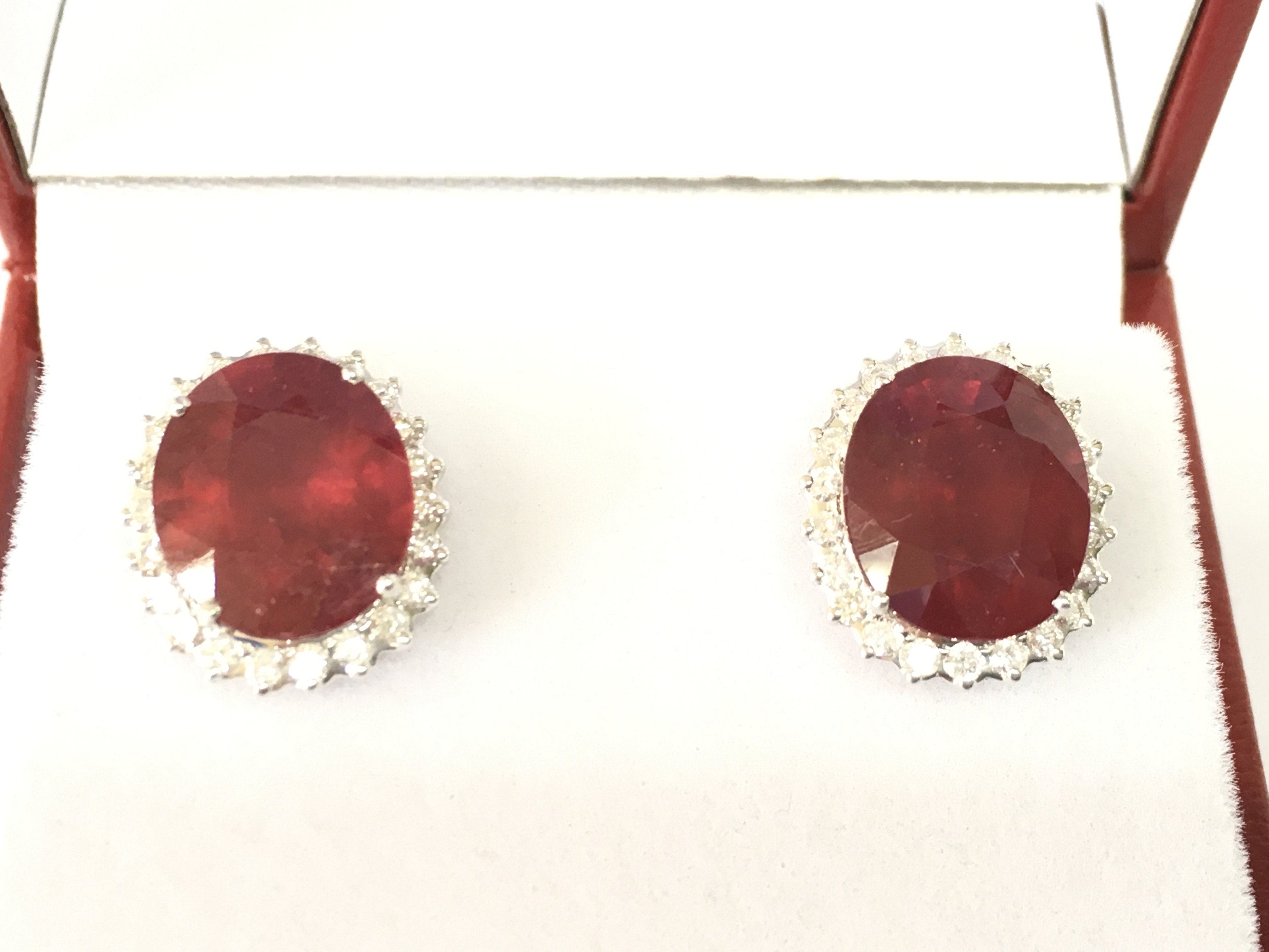 Large 18ct white gold ruby and diamond cluster earrings. Rubies ( glass filled) 8.71ct and diamonds 0.80ct. Postage B