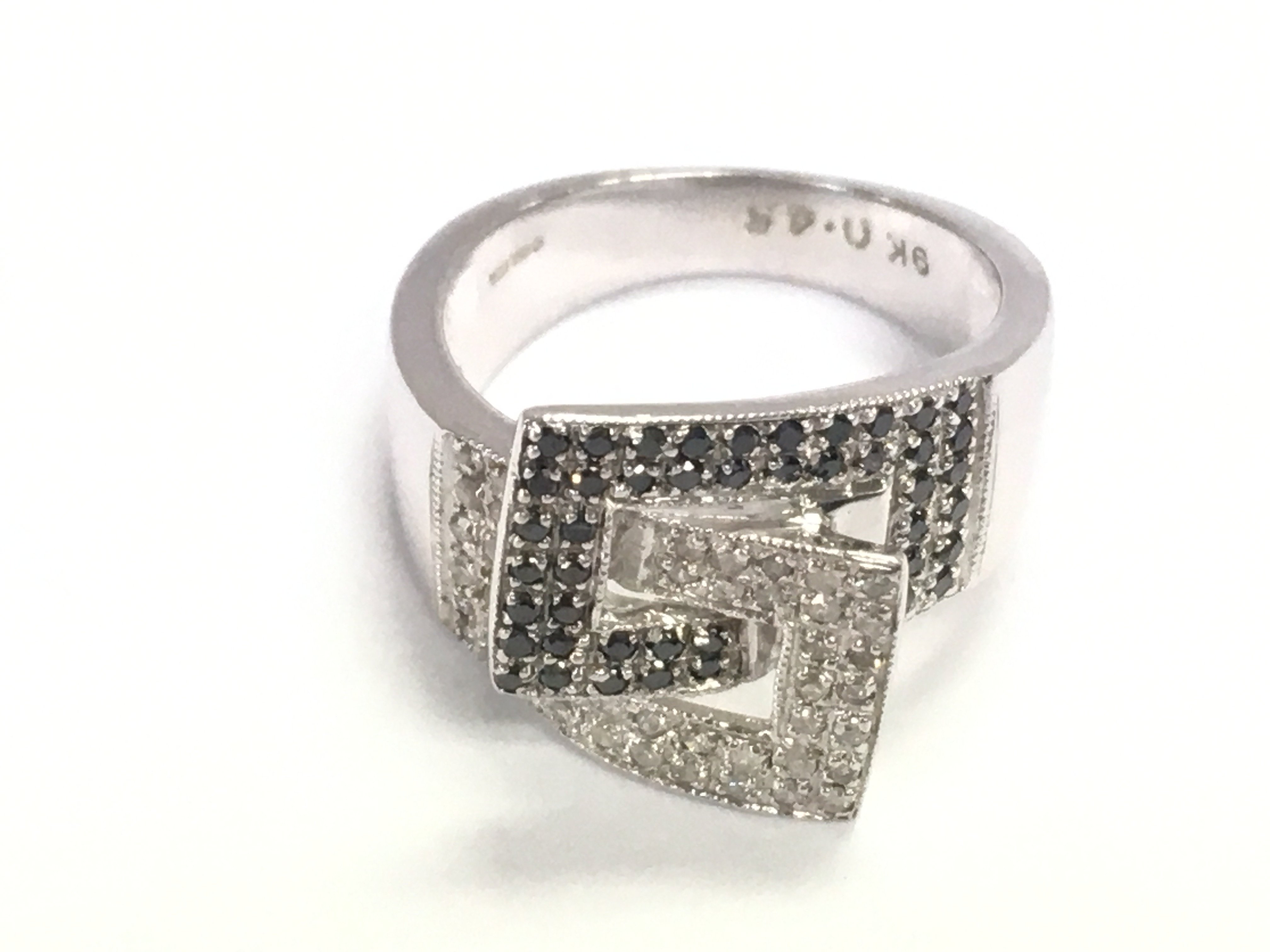 Mid century style 9ct white gold ring set with black and white diamonds approximately 0.45ct total size K