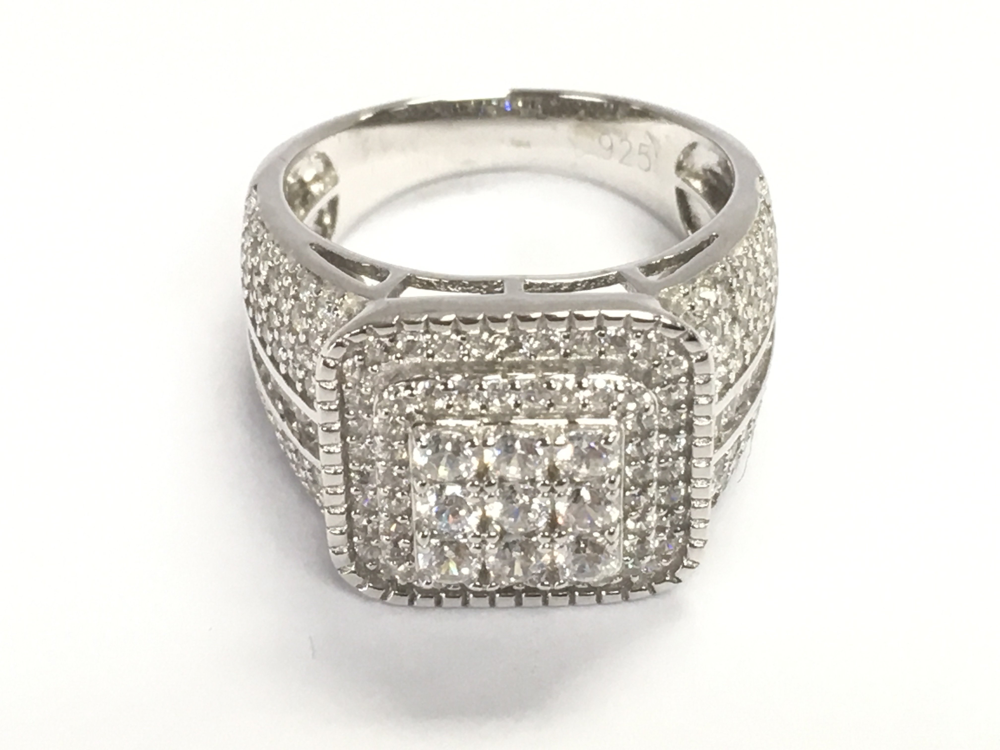 Square checkerboard style silver gents ring set with round and baguette CZs. Size M