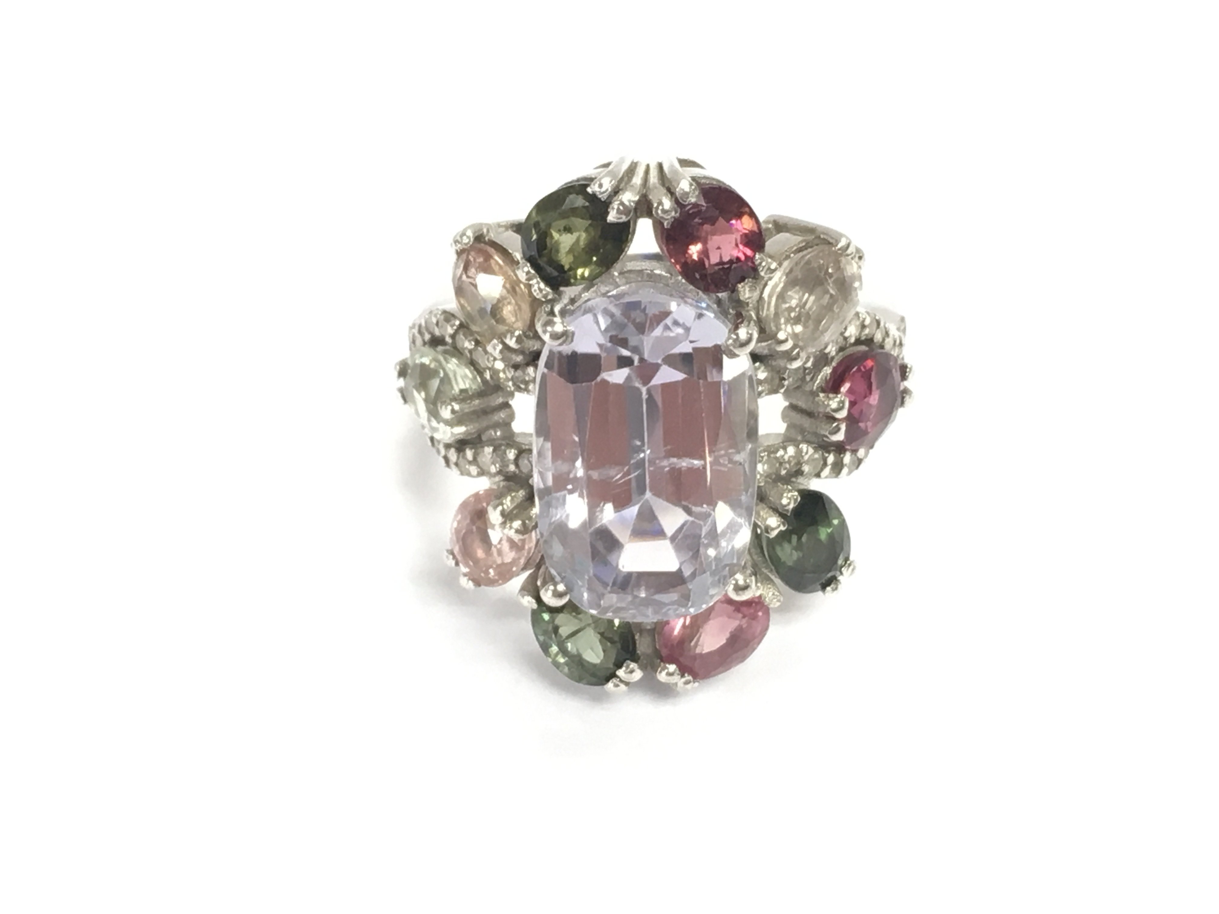Large silver dress ring set with a central mixed cut spodumene with surrounding multi coloured tourmalines and diamonds. Spodumene 8.25ct tourmalines 4.25ct and 0.31ct diamonds. Size N