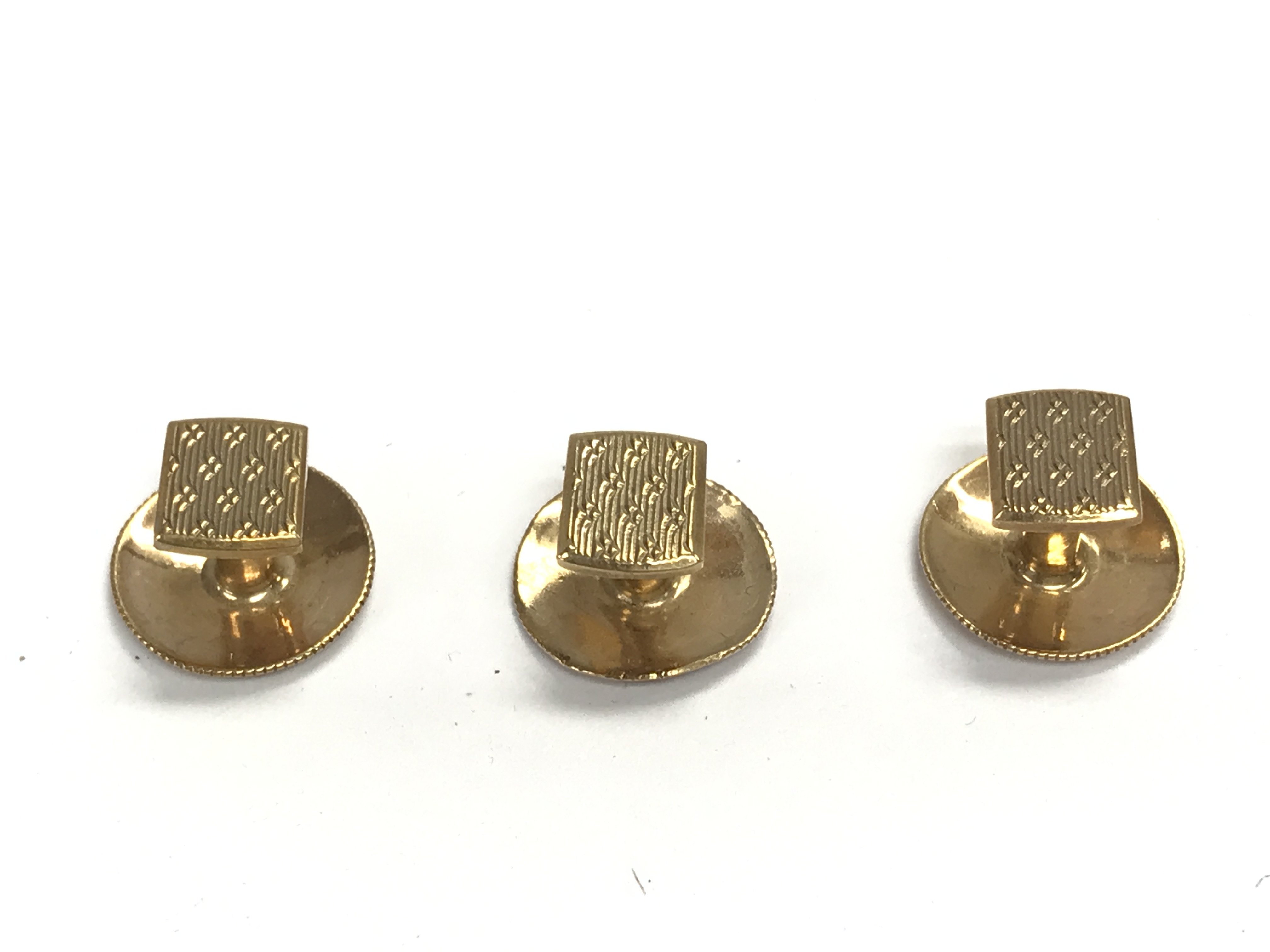 Set of three 9ct gold studs. 2.86g.