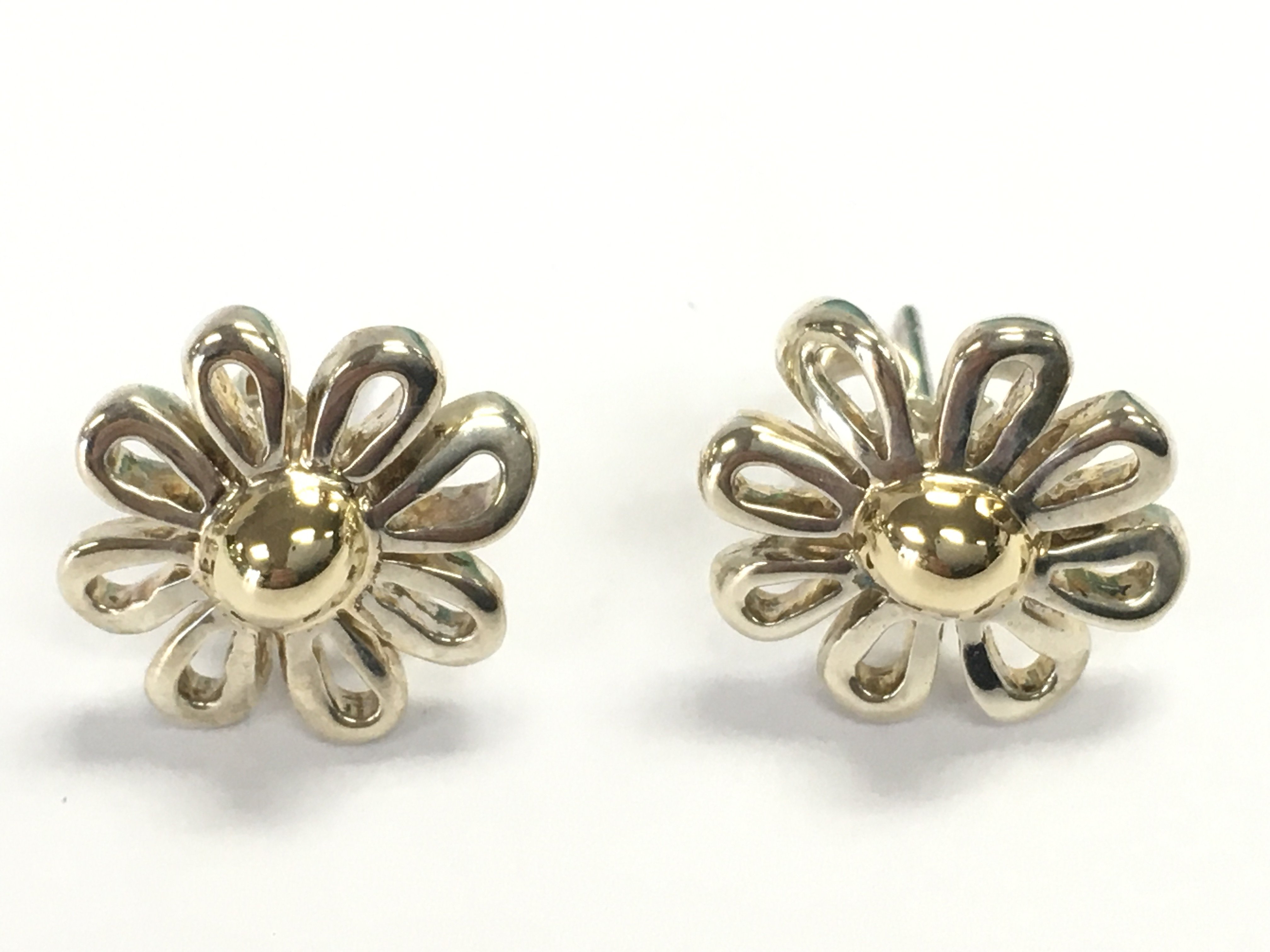 A Tiffany and Co pair of Elsa flower studs. Postage B