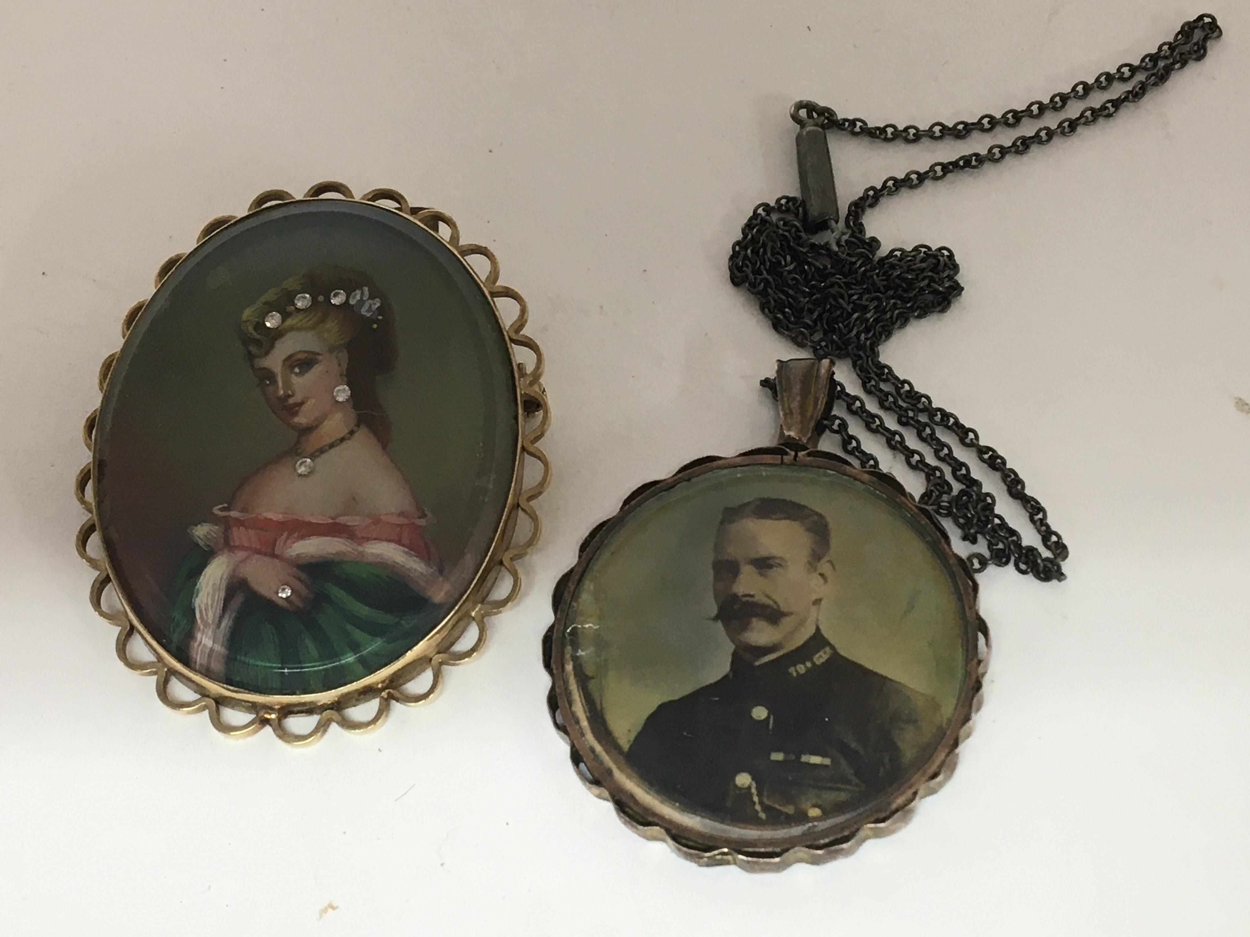 A 9carat gold brooch of oval shape with a portrait of a lady with applied stones and one other vintage double sided portrait pendent (2)