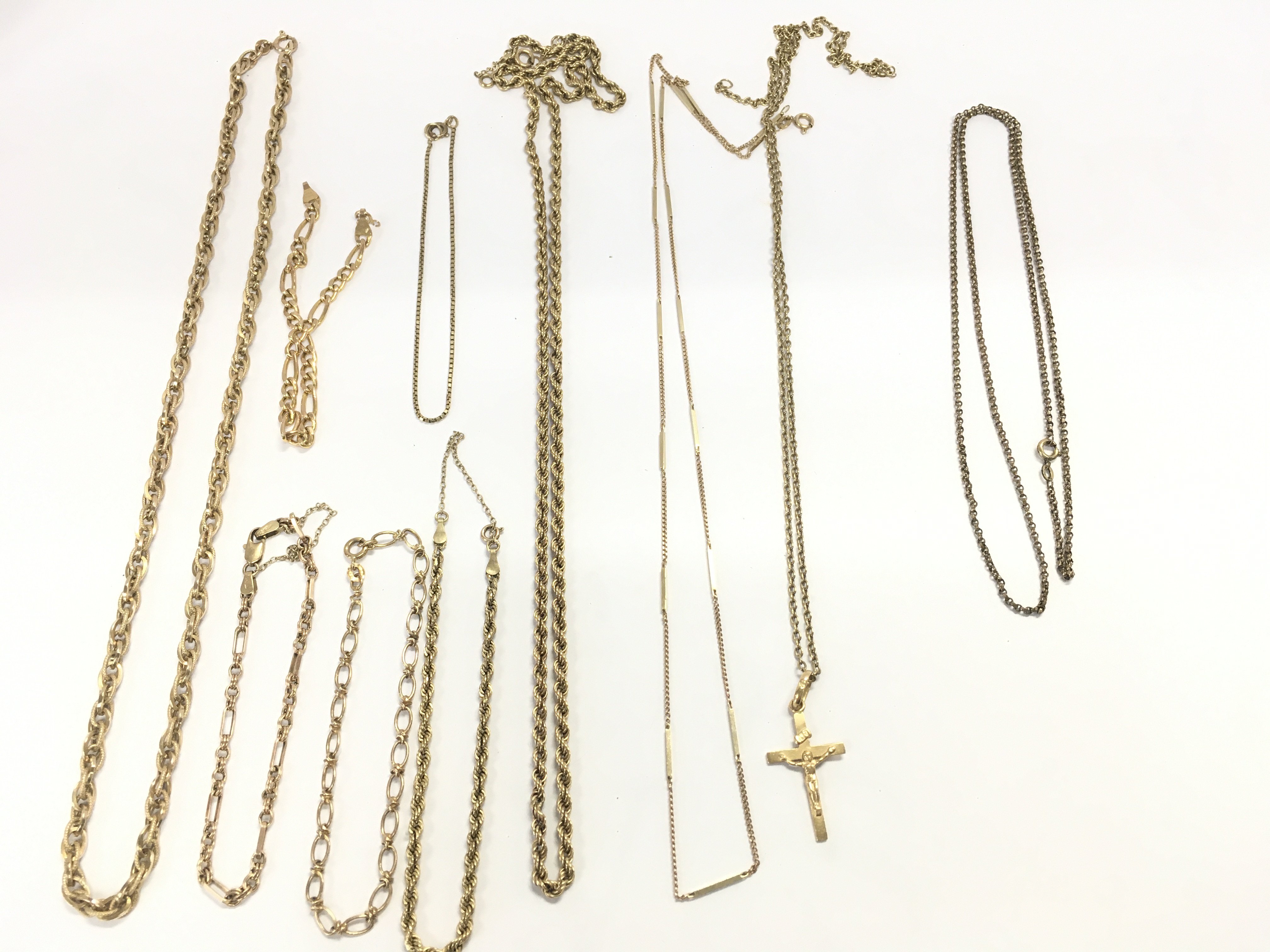 A collection of assorted 9ct gold chains 45g and on yellow metal one. Postage B