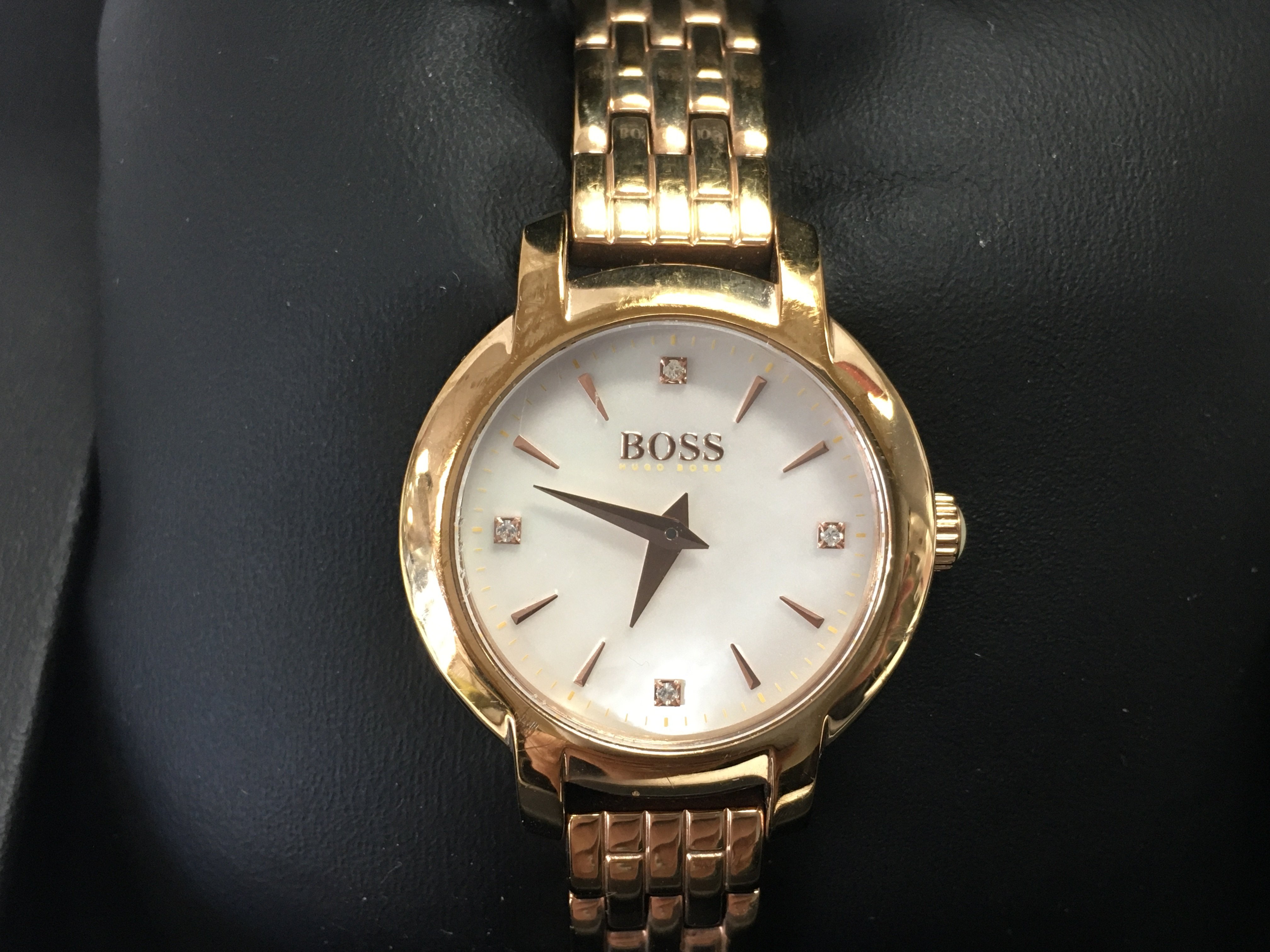 A ladies Hugo boss watch with MOP dial. Comes with box. Postage B