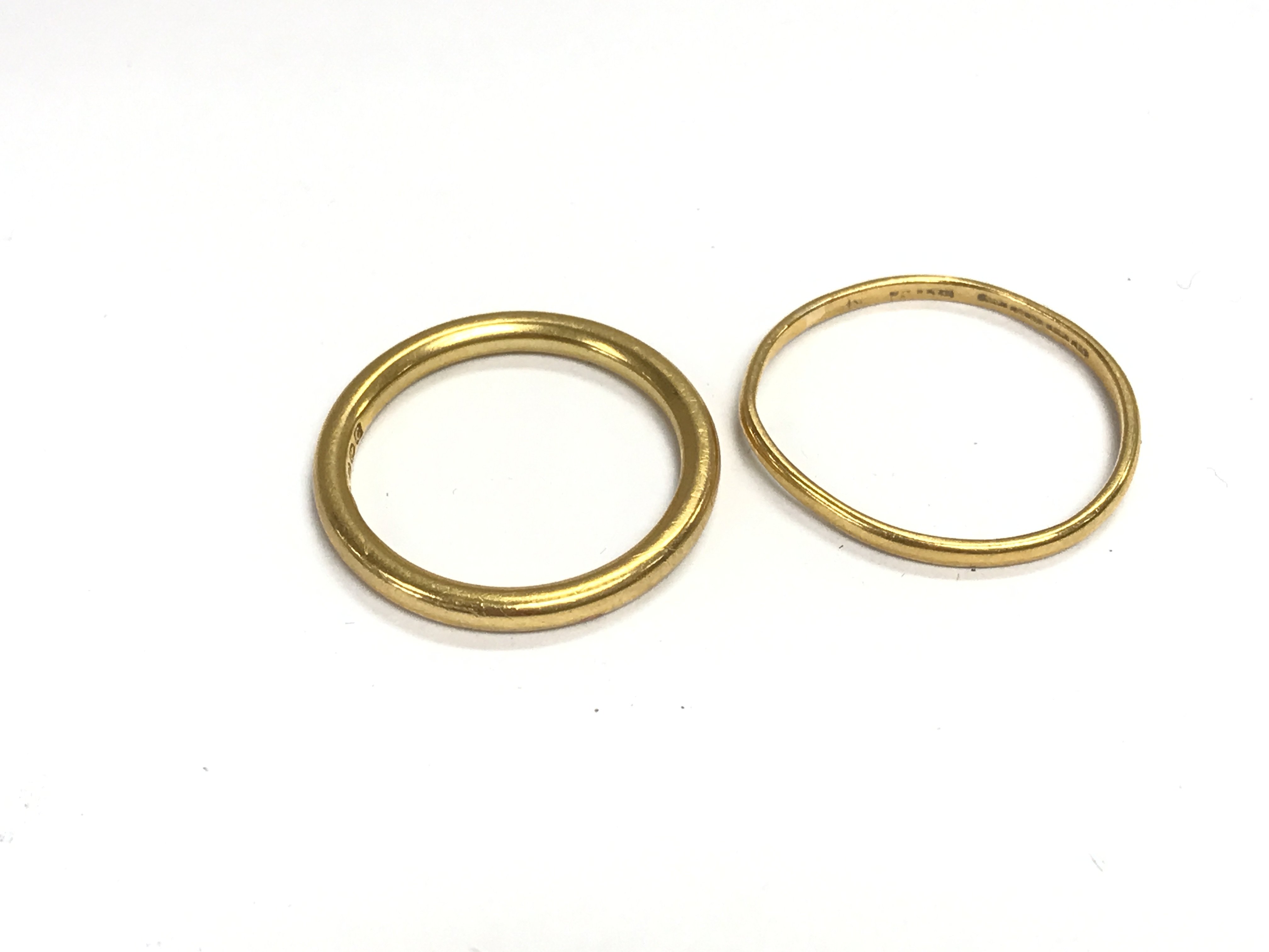 Two 22ct gold bands. Total weight 7.6g Postage A