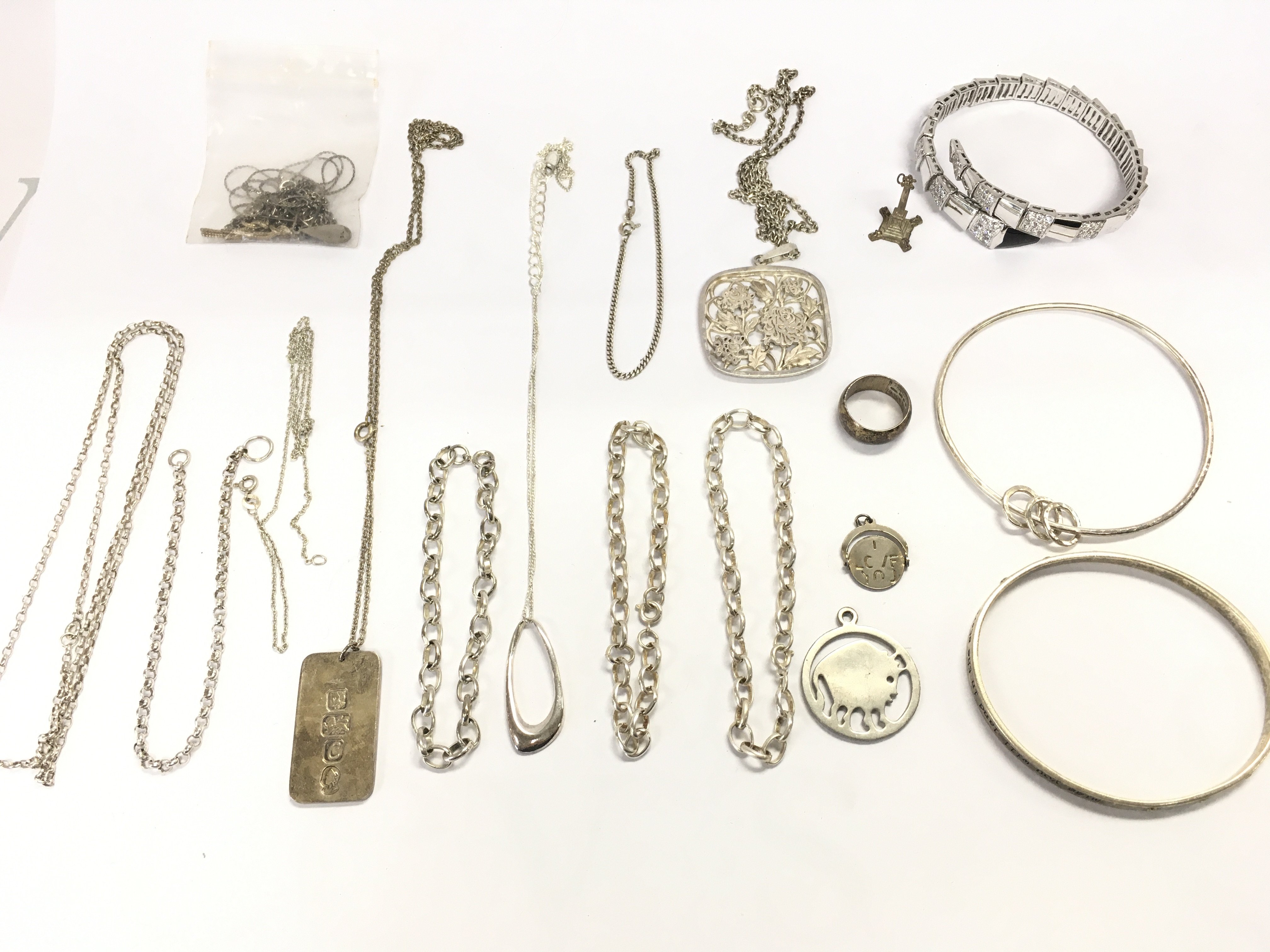 A collection of assorted silver jewellery items including chains bracelets etc Approx 155g Postage B