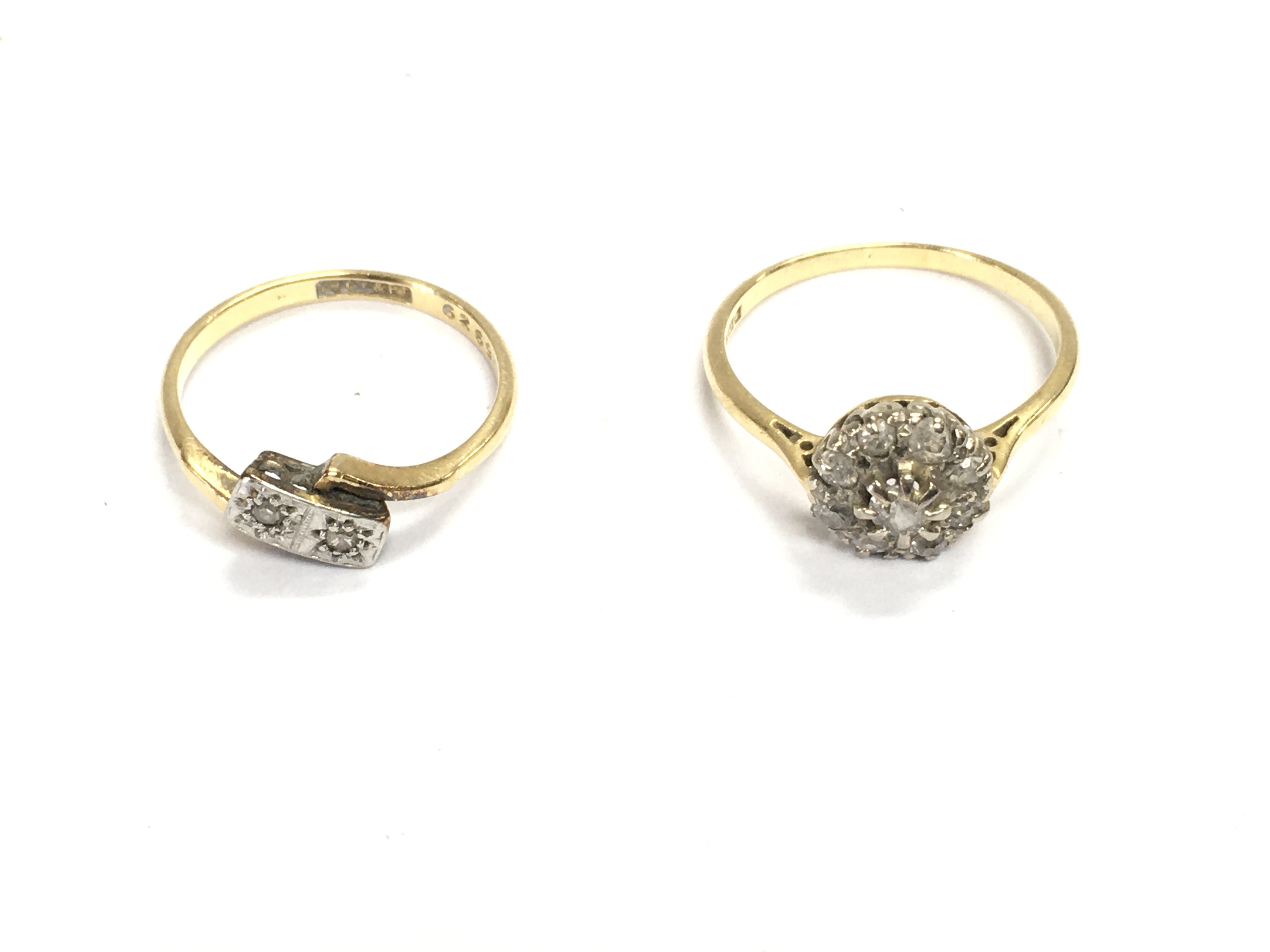 Two 18ct gold rings set with diamonds size M and P 5.09g total.