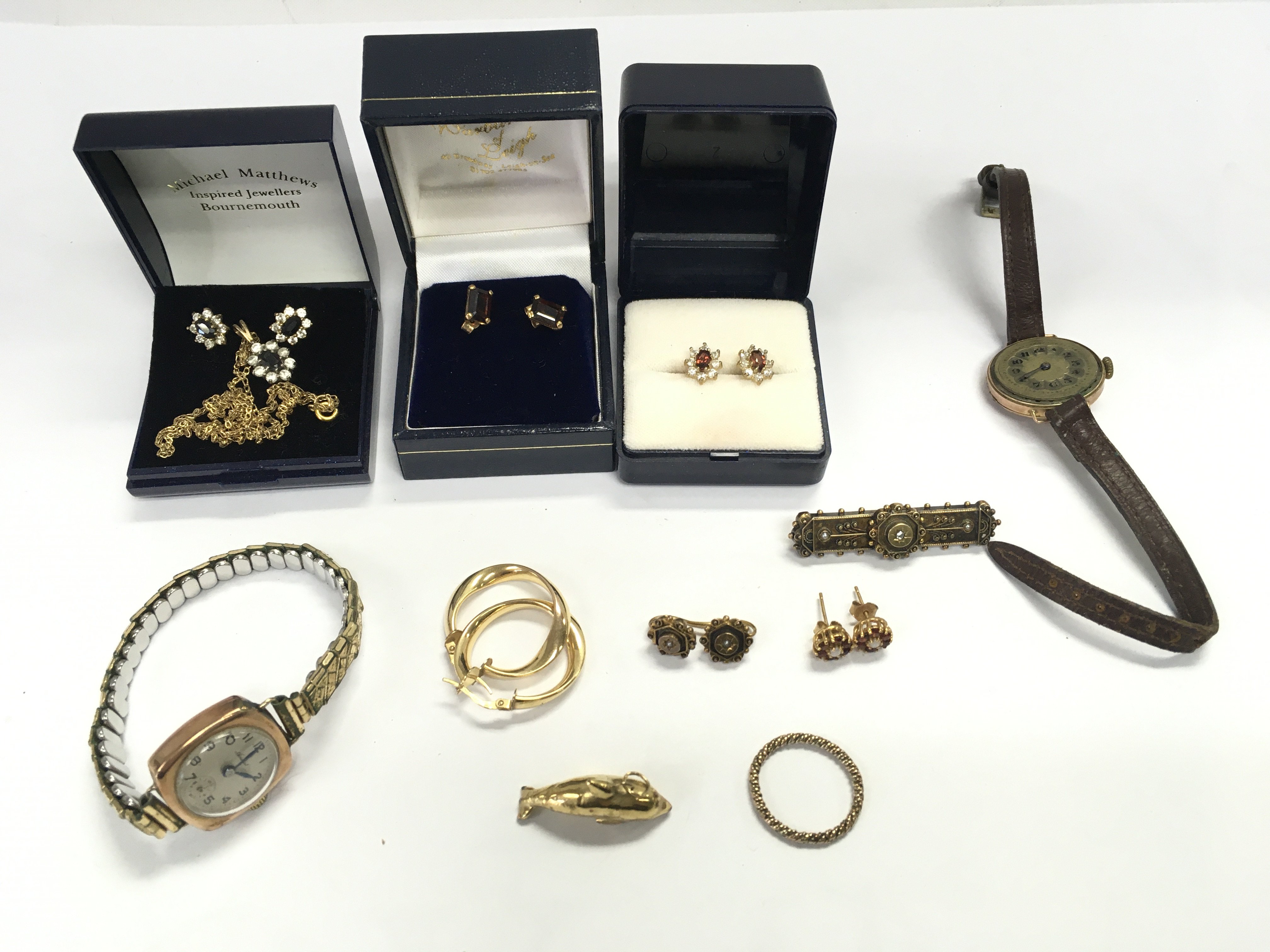 A collection of assorted 9ct jewellery including earrings gold cased watches etc Postage B