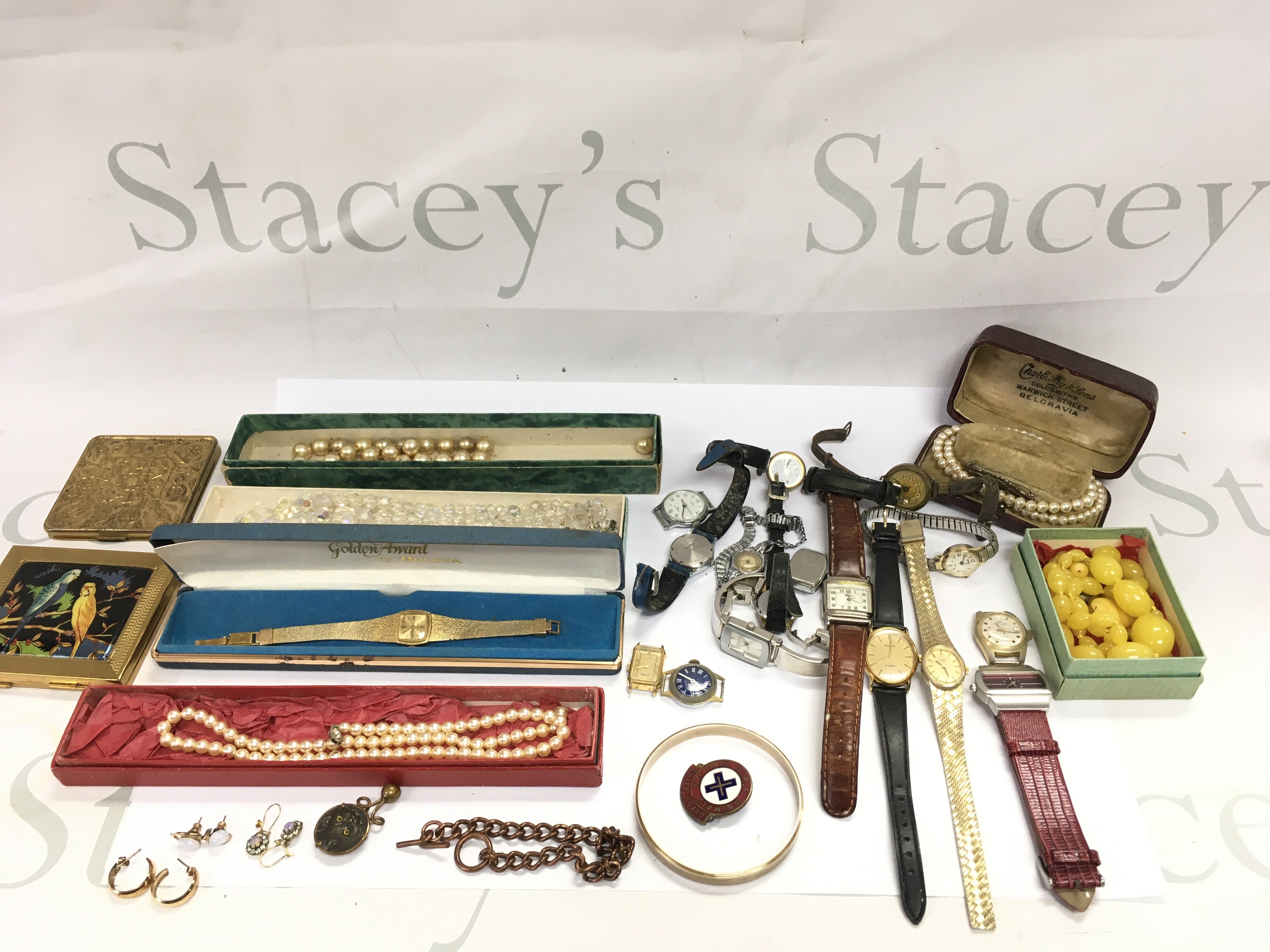 A collection of assorted costume jewellery including watches. Postage B