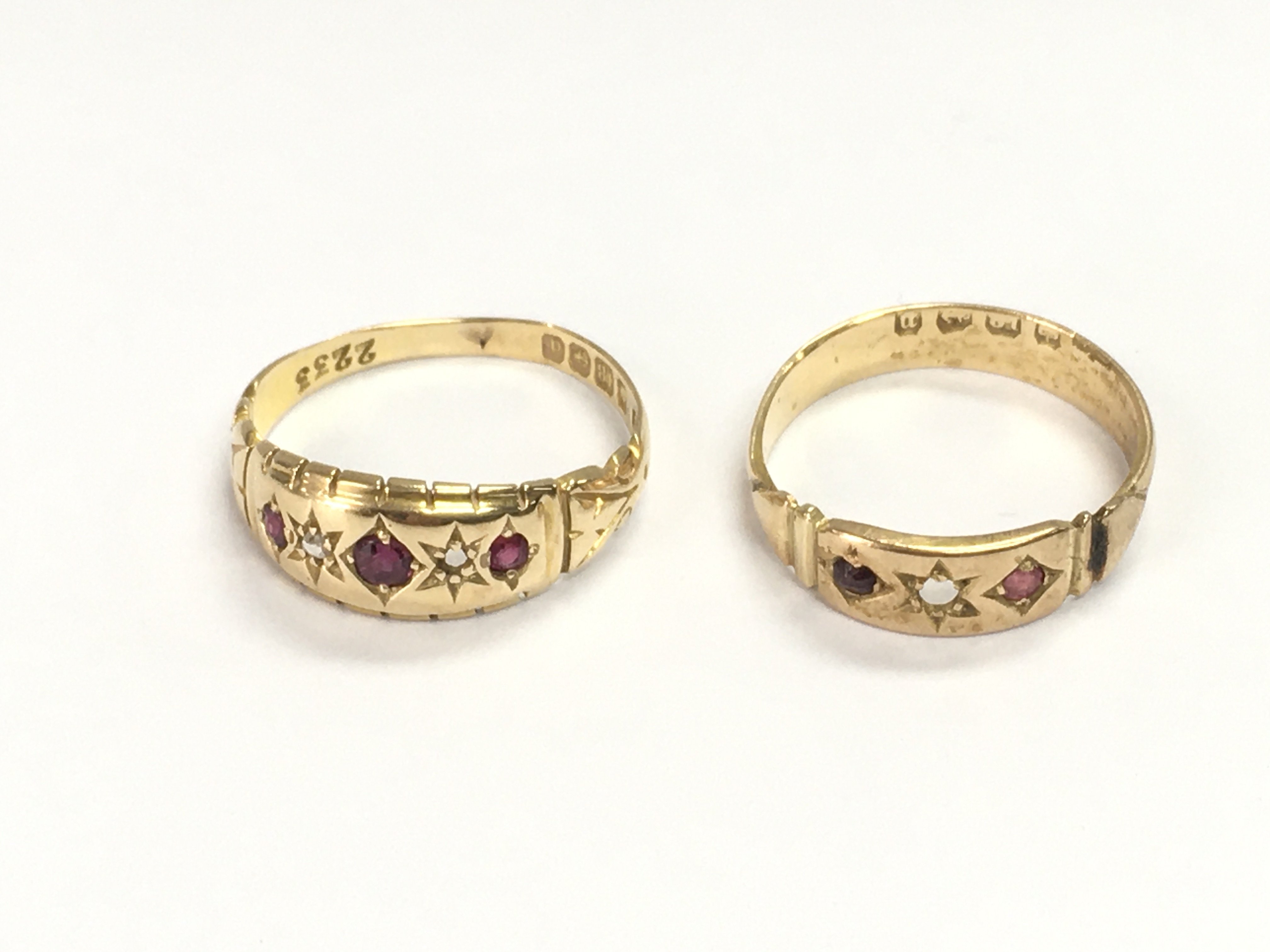 Two 18ct gold rings set with small rubys. Size P and N 1/2 5.97g