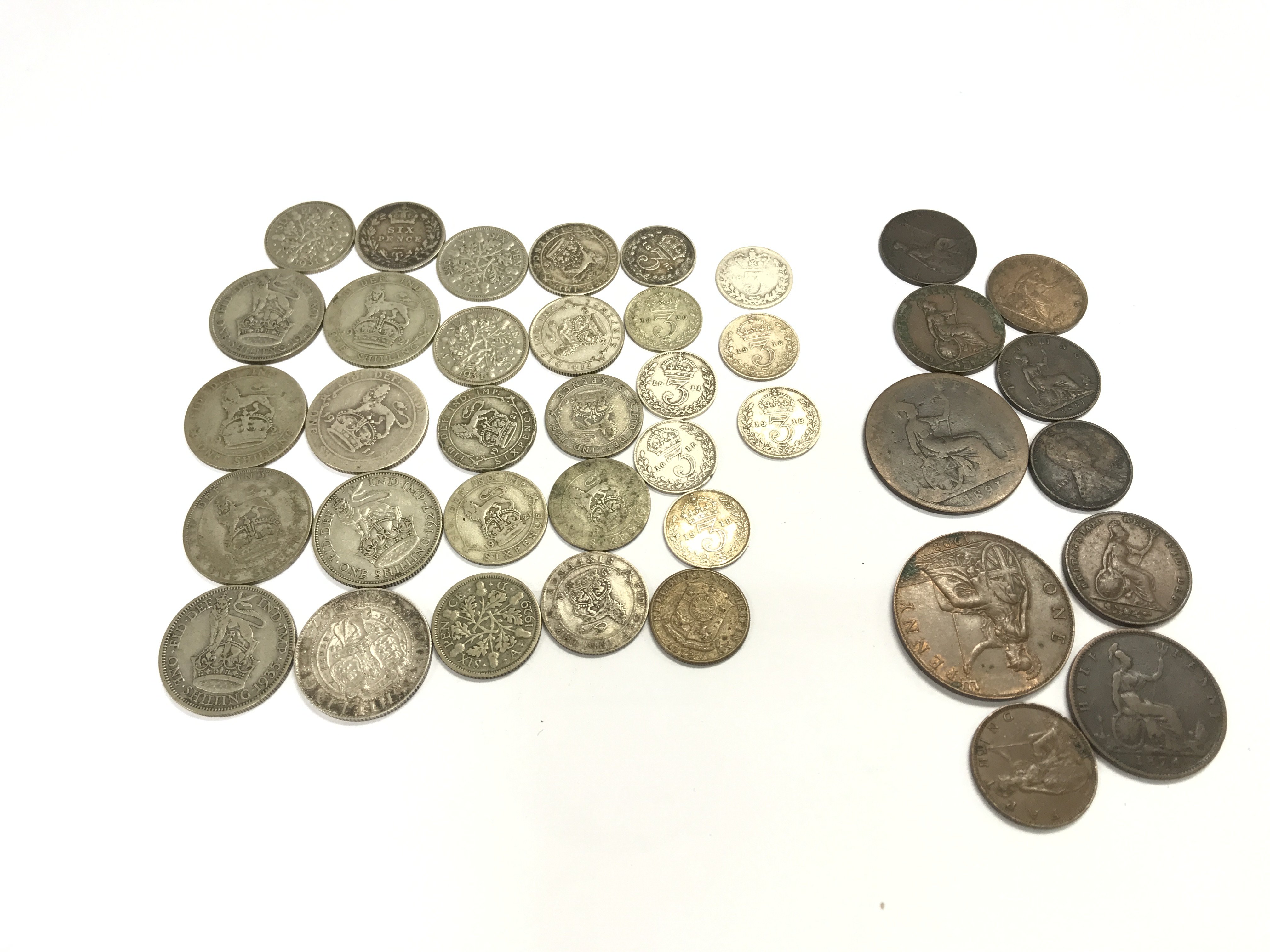 A collection of assorted coinage including pre 1946 90g and a 1897 one shilling. Postage B