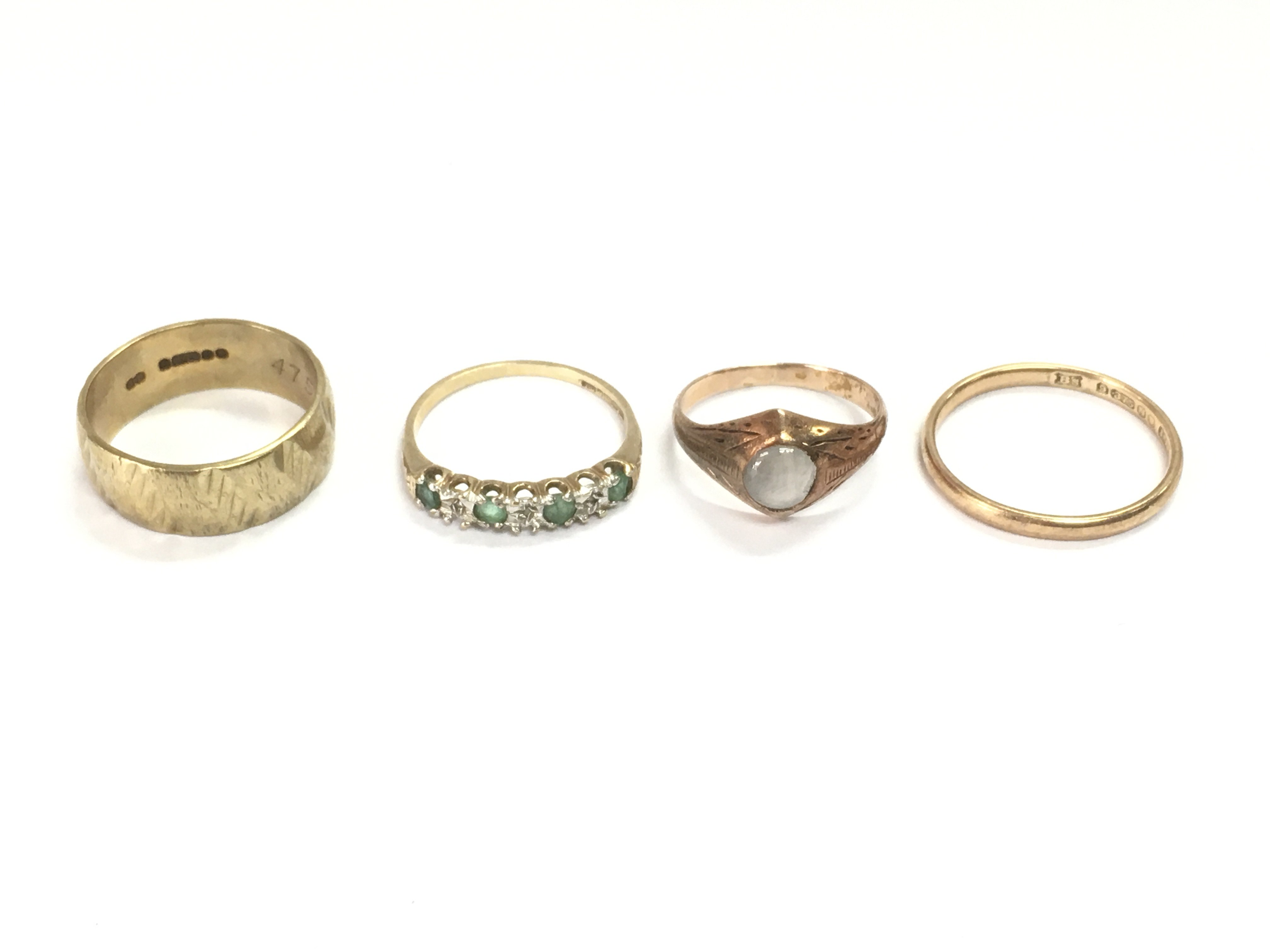 Four 9ct gold rings including two bands and two set with stones. 10.24g Postage A