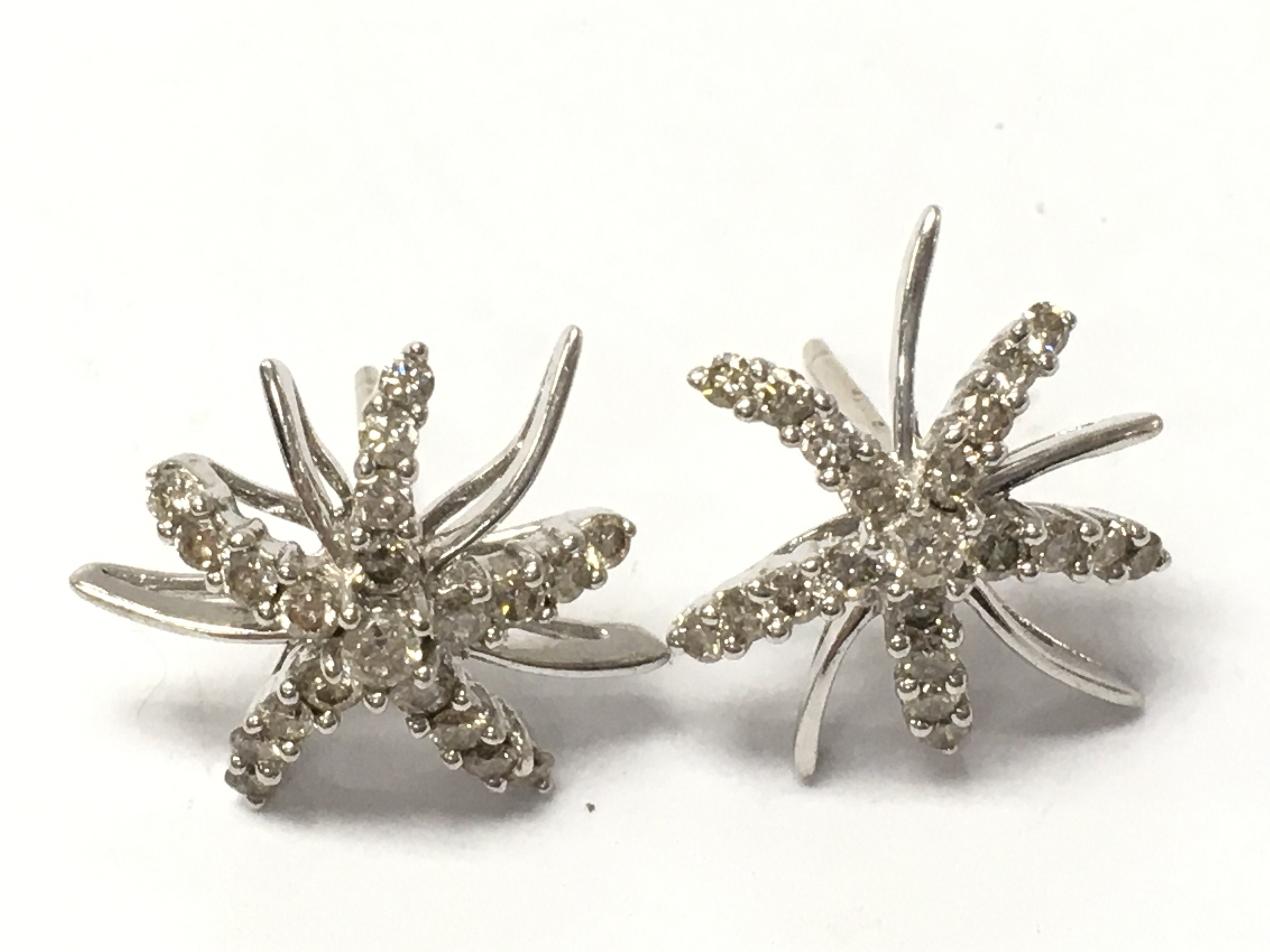 18ct white gold diamond star studs , Total weight 2.8g .postage category A