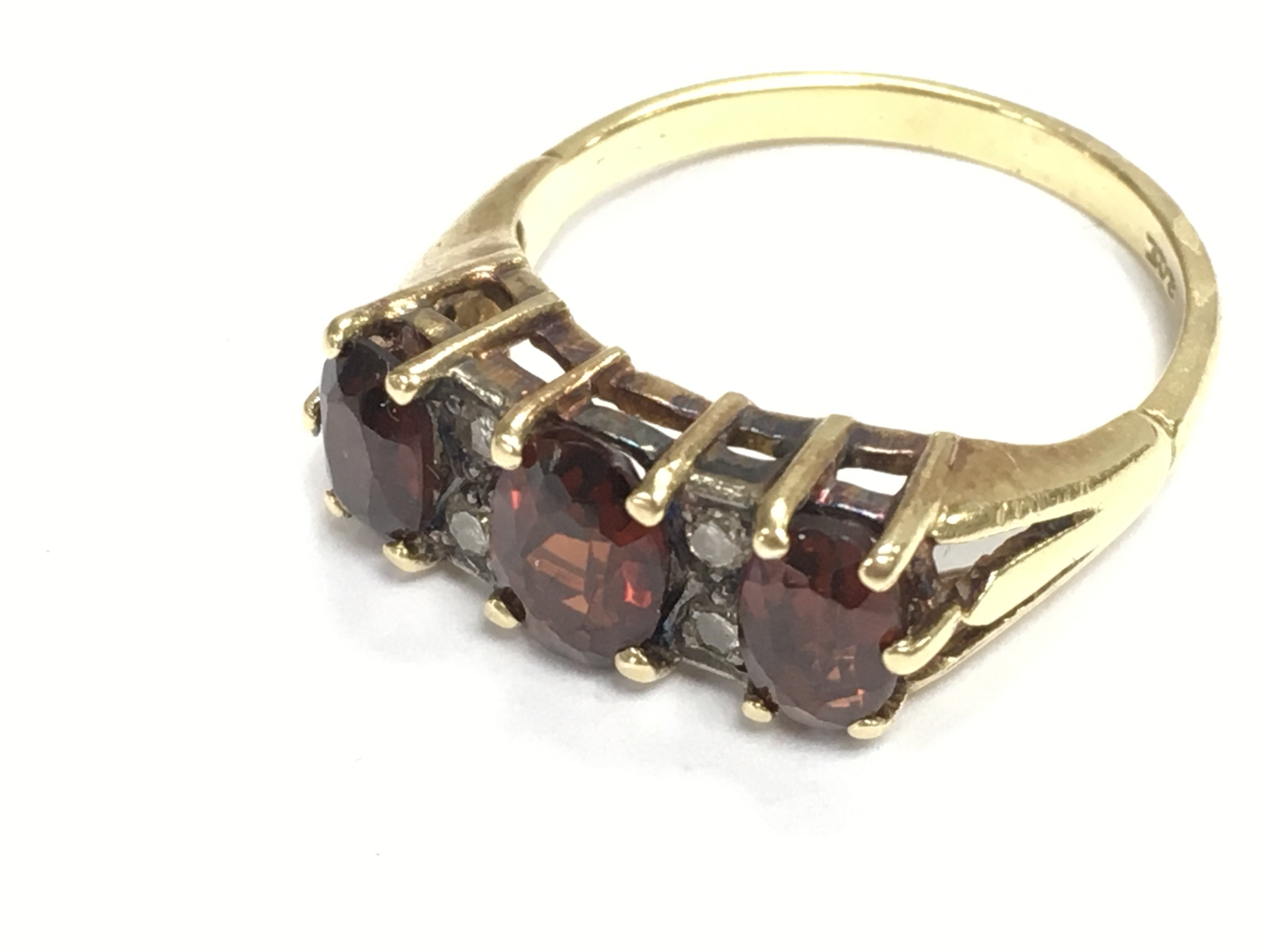 A 9ct gold and garnet ring. Size O and 4.57g Postage A