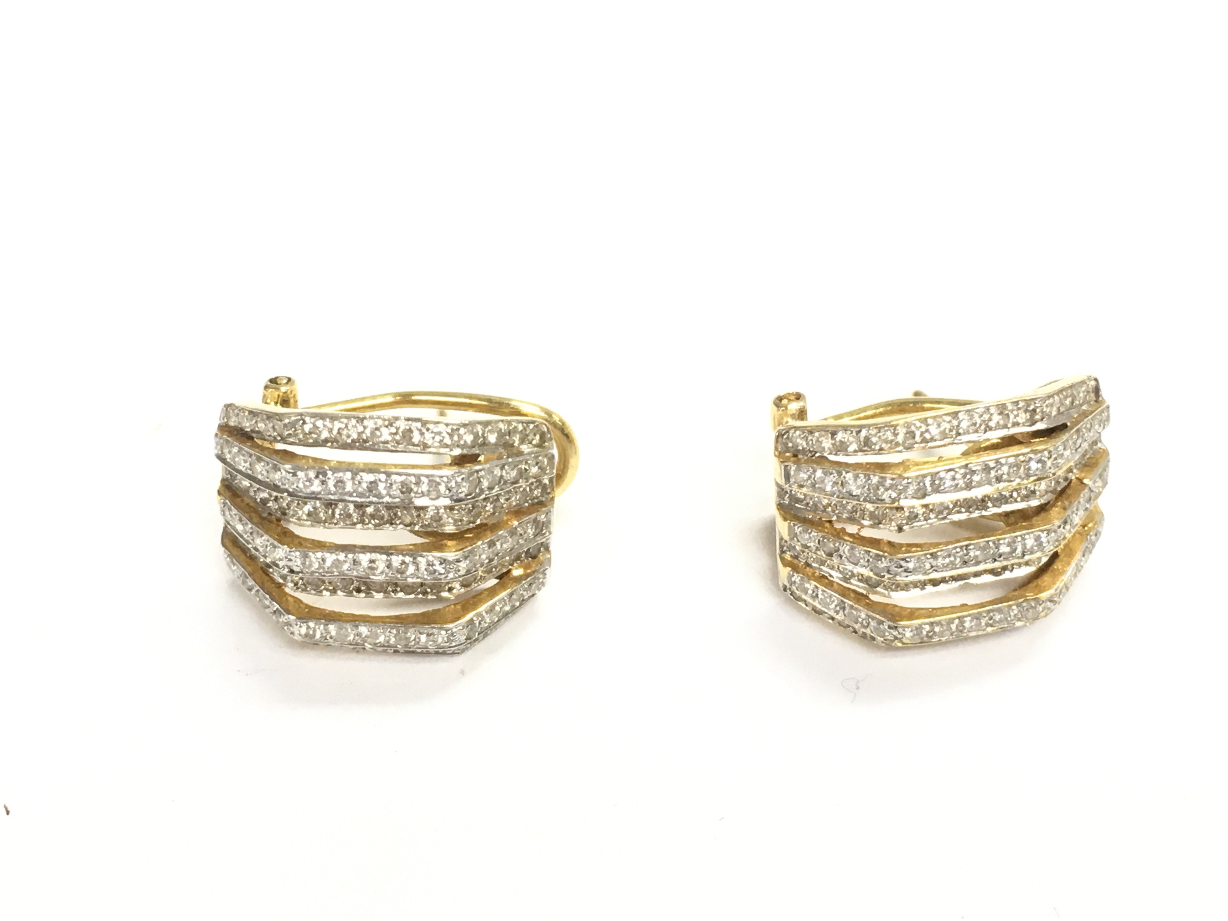 A pair of gold diamond cluster earrings. 9.09g
