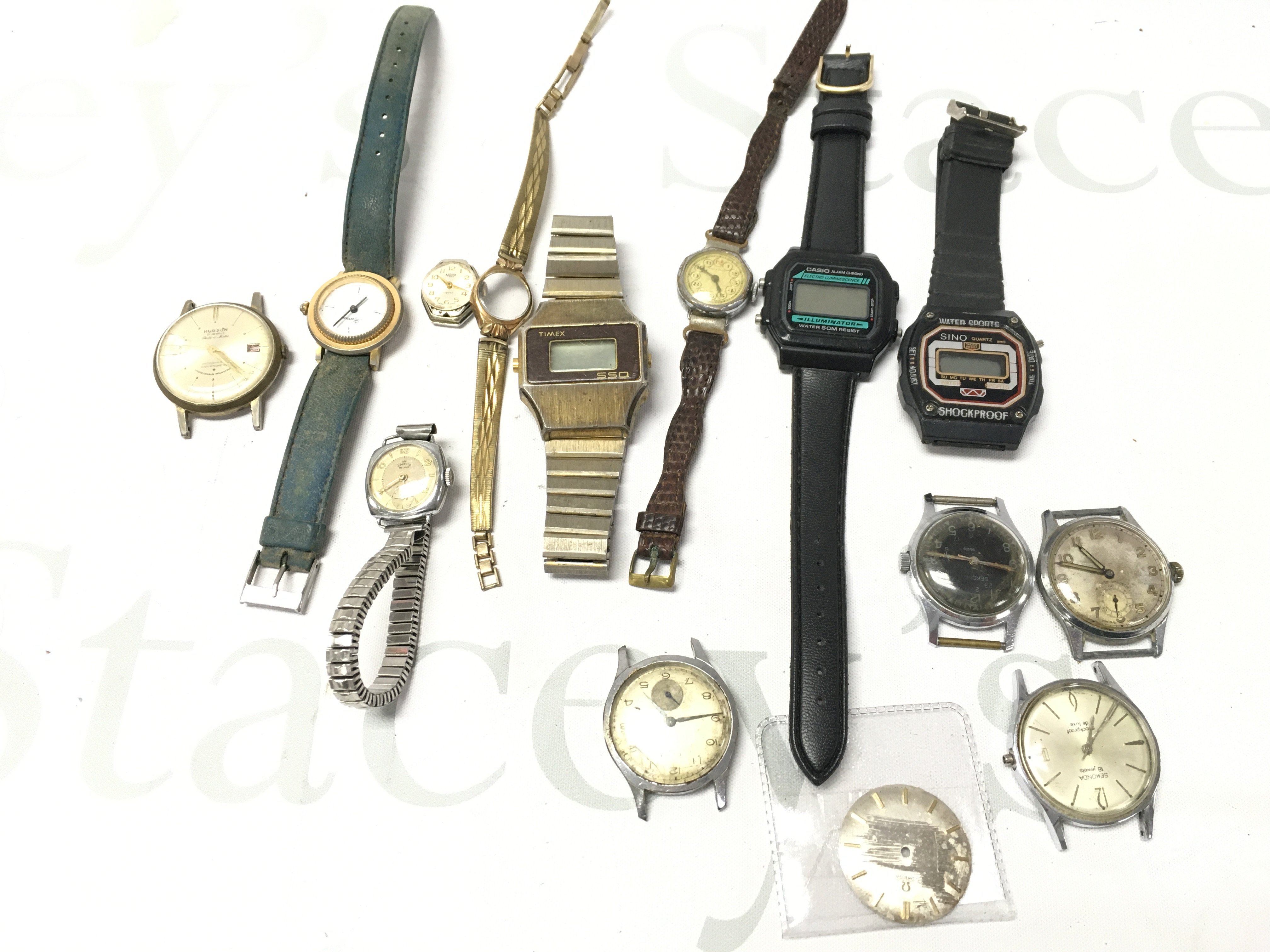A Collection Of Vintage Watches Including A Hudson 21 Jewles Date O Matic. Sekonda 18 Jewles. Smiths De Luxe. Medana Lever 17 Jewels. Rotary. Casio Etc.