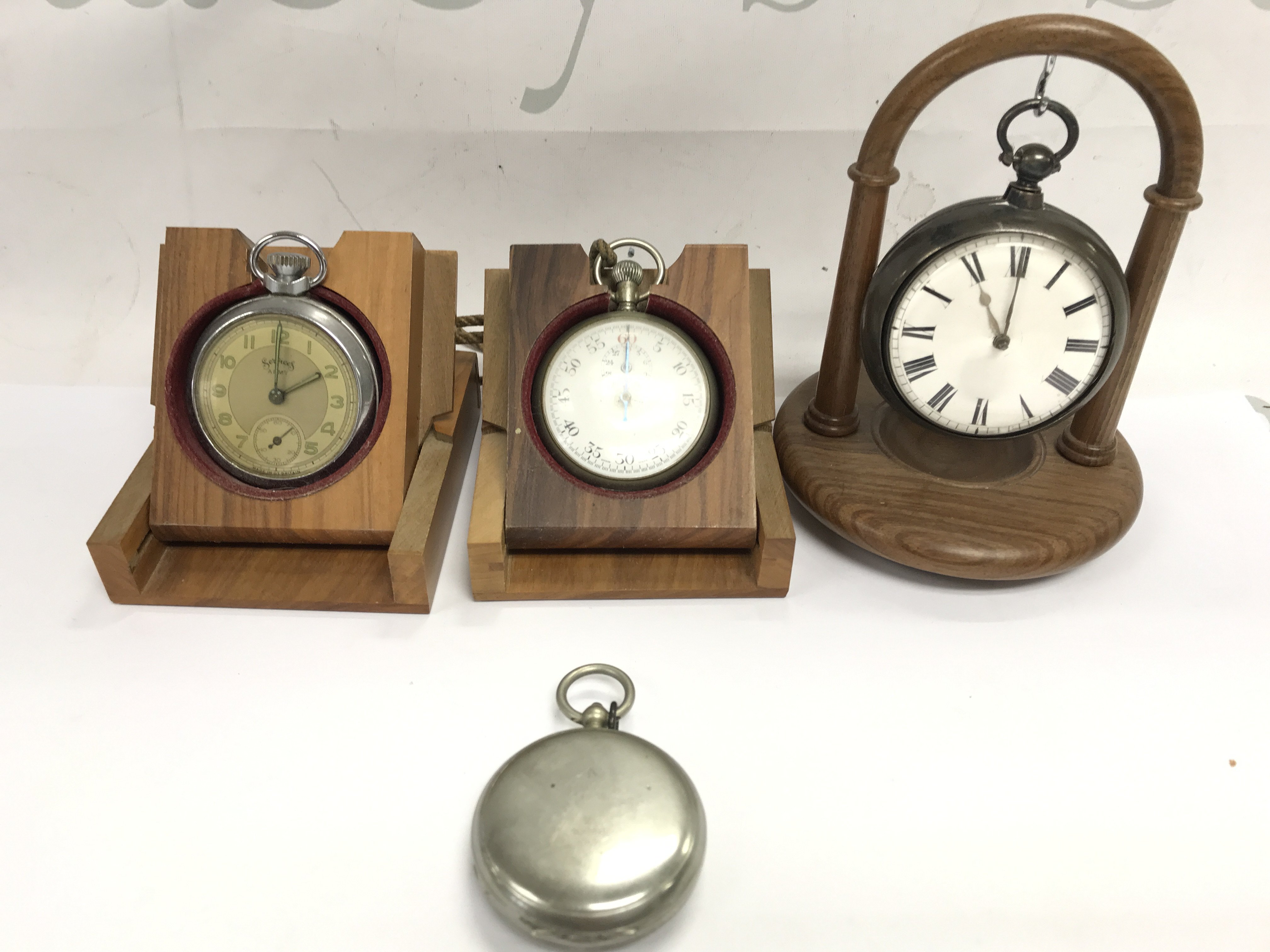 A collection of pocket watches including a silver example. Also contains a L Kama 1915 military issue compass. Postage B