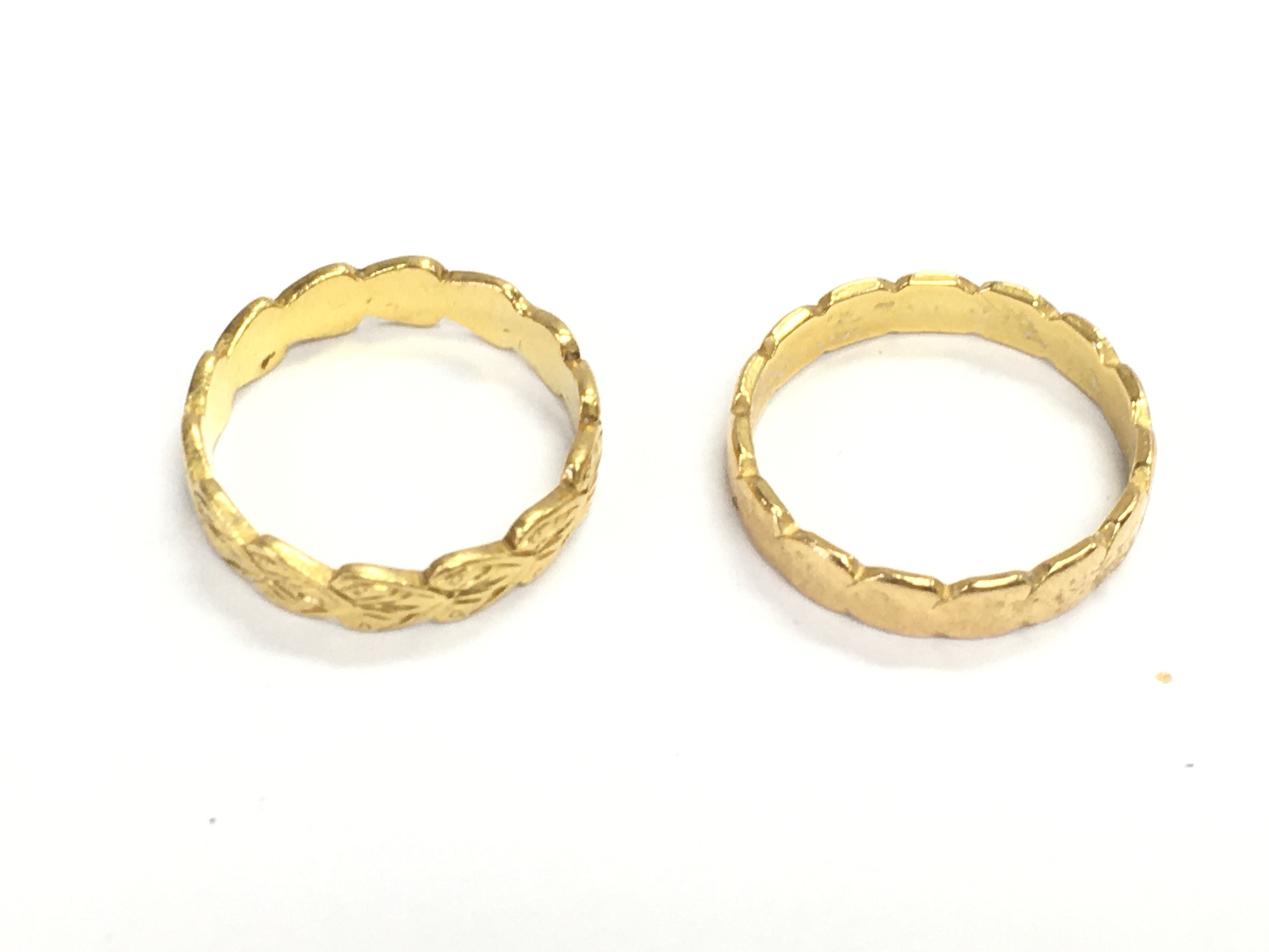 Two 22ct gold bands. 5.61g Postage A