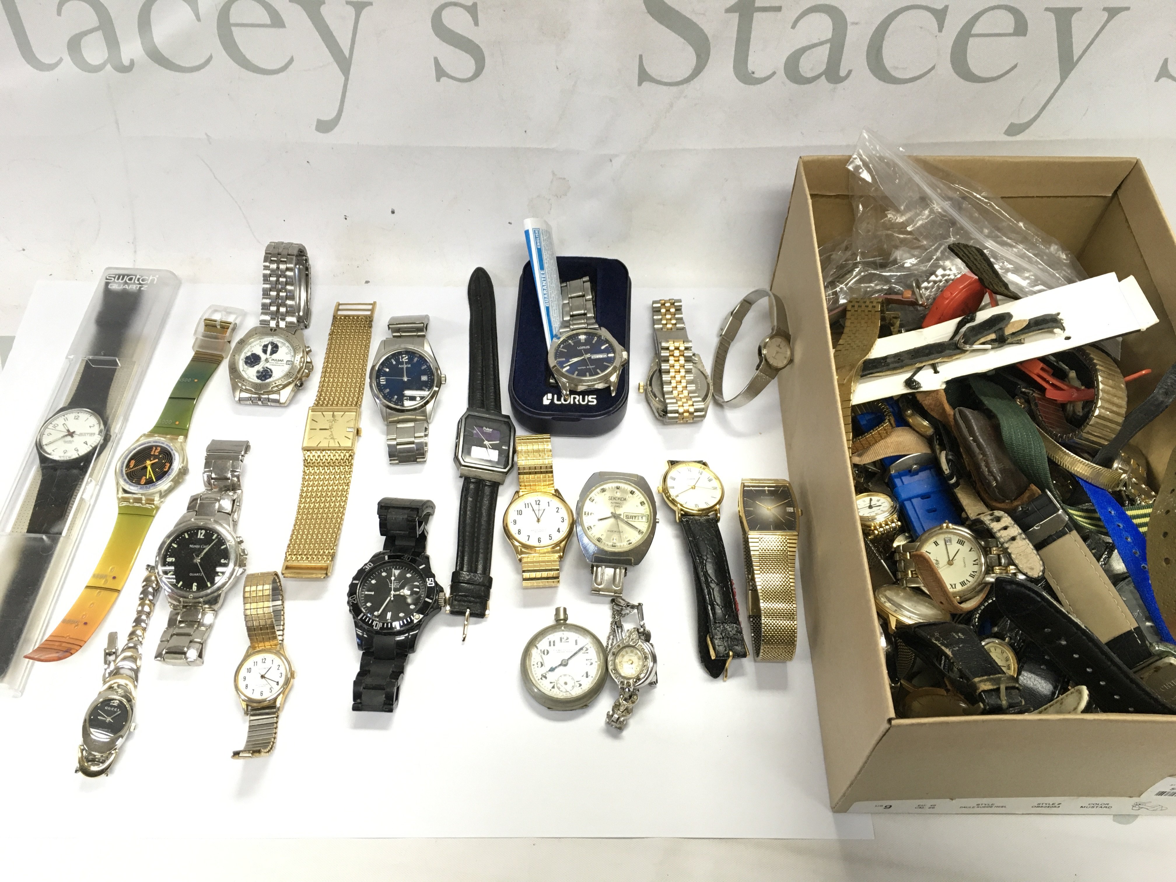 A box of mixed watches including pulsar Accurist Swatch D&G etc Postage B