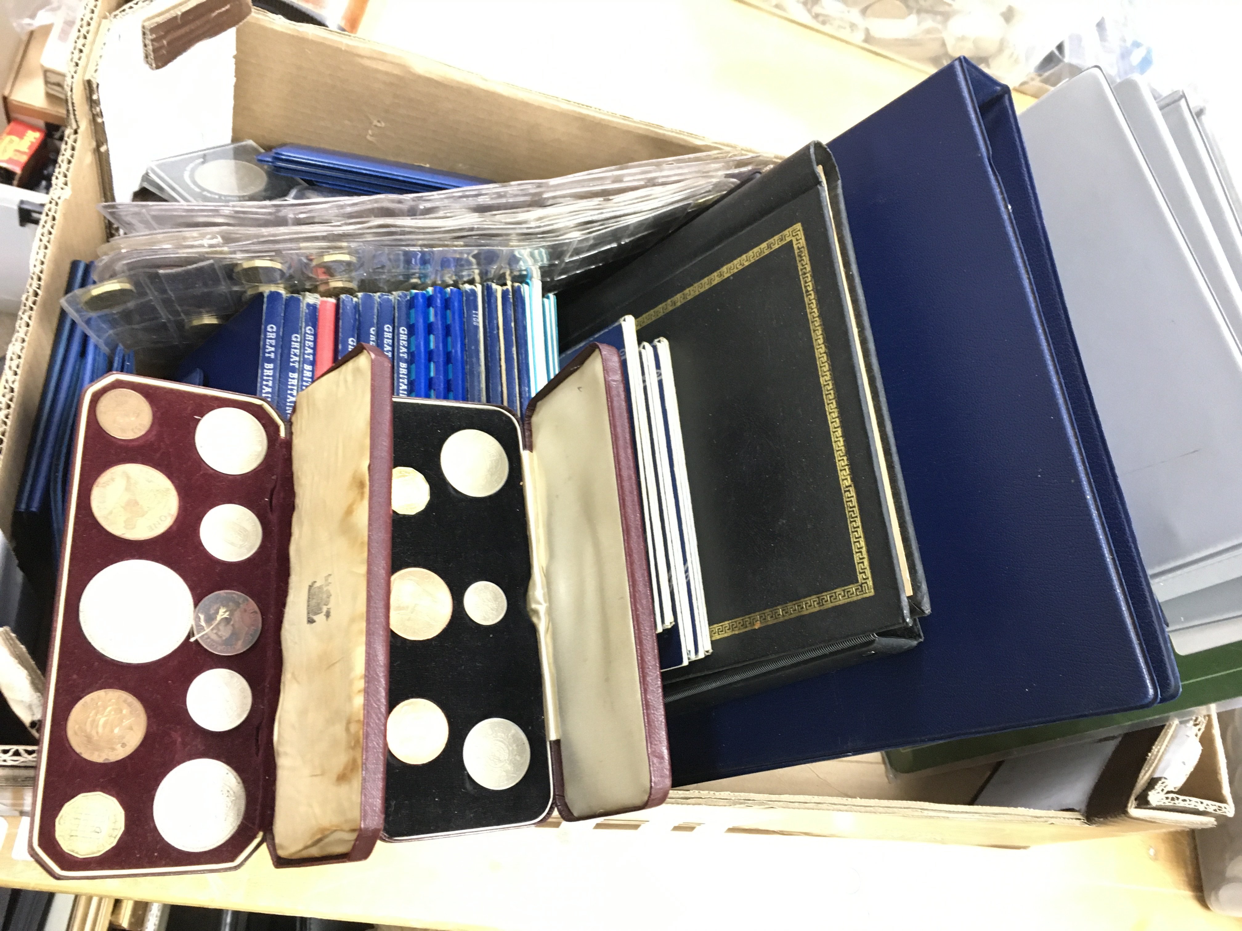 A collection of albums and folders of British coinage and some world notes. Postage C