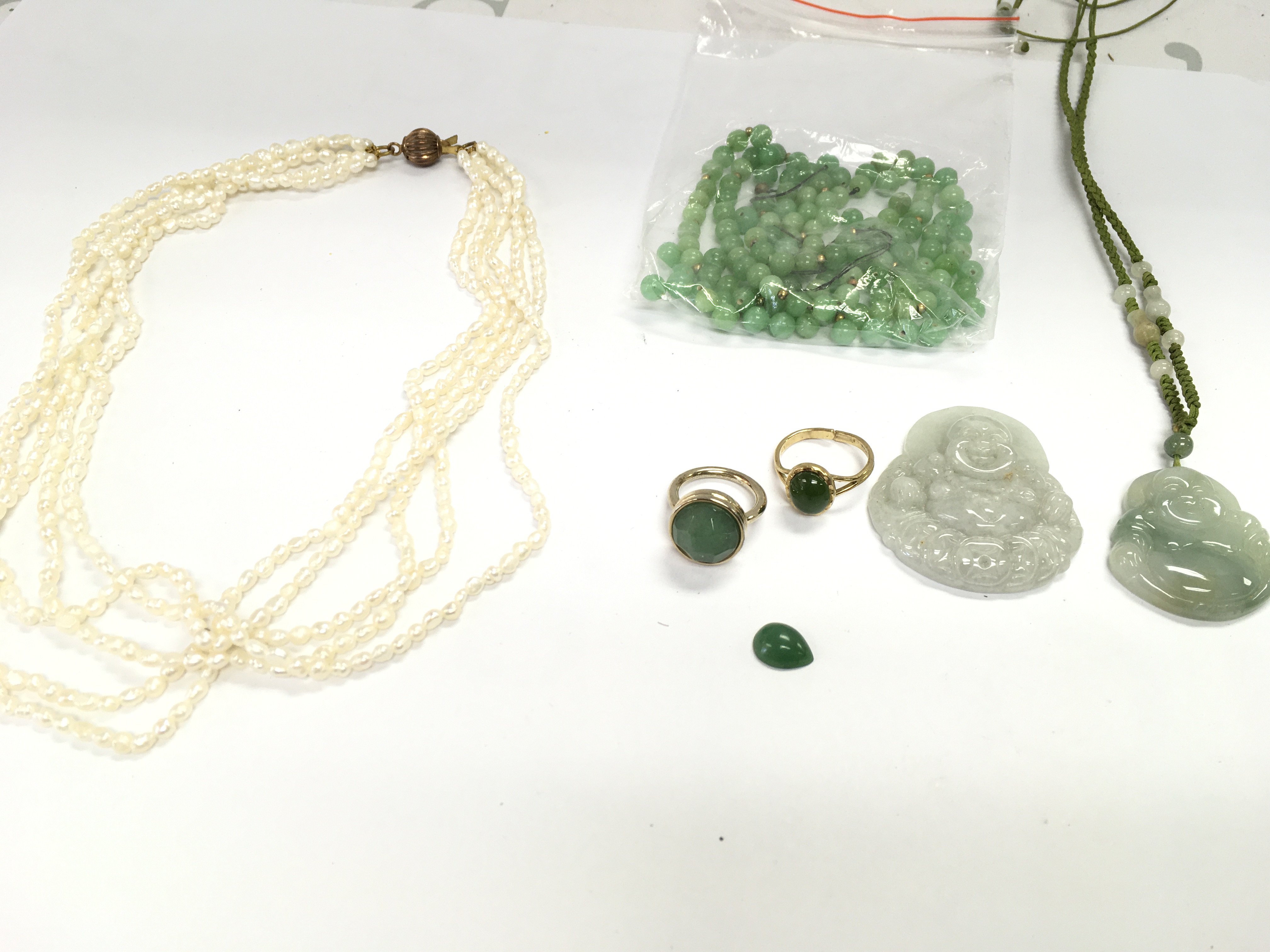 A collection of Jade and Pearl jewellery. Postage B