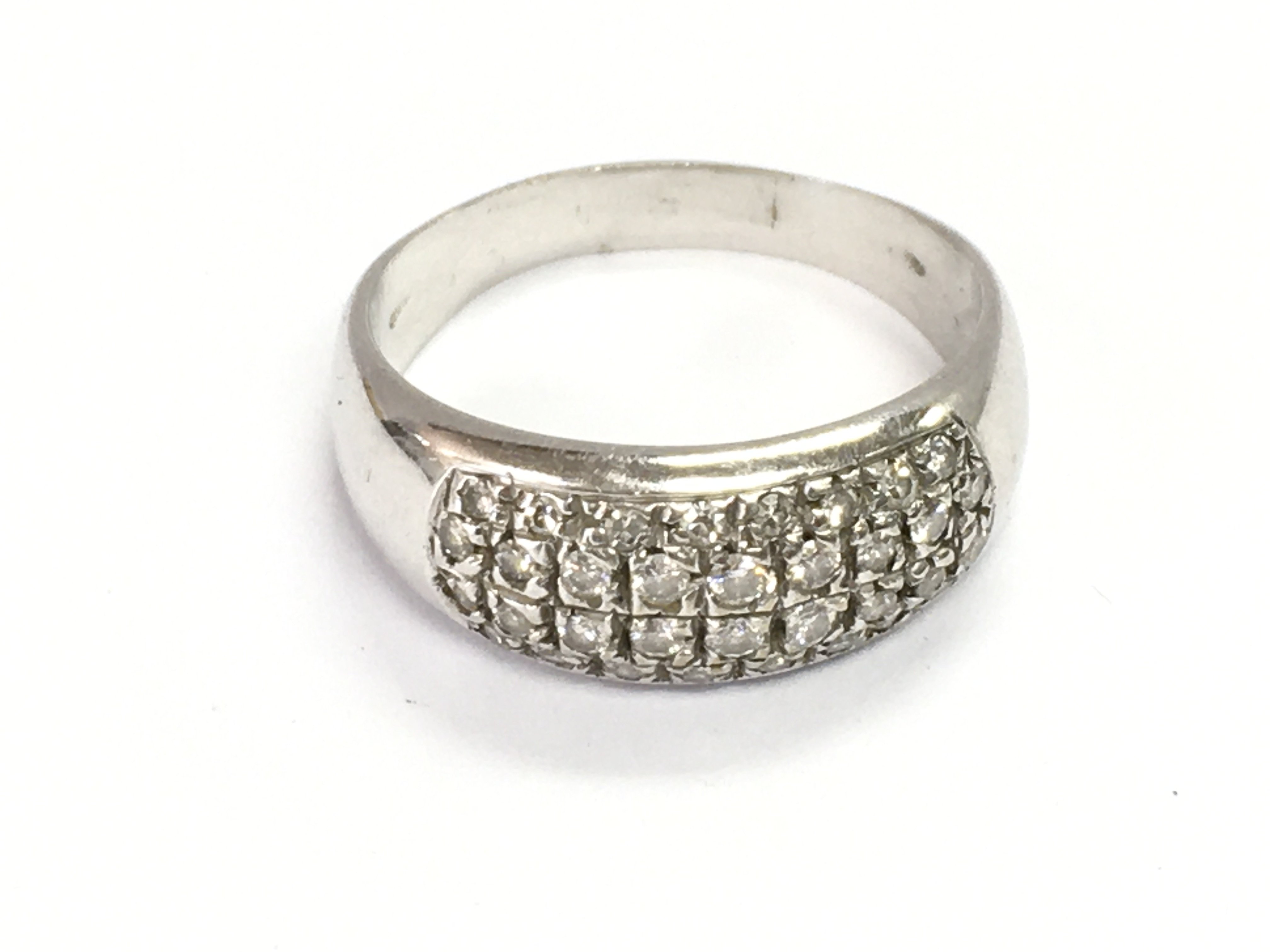 An 18ct white gold and diamond pave set ring with Italian hallmark. Size T and 6.46g