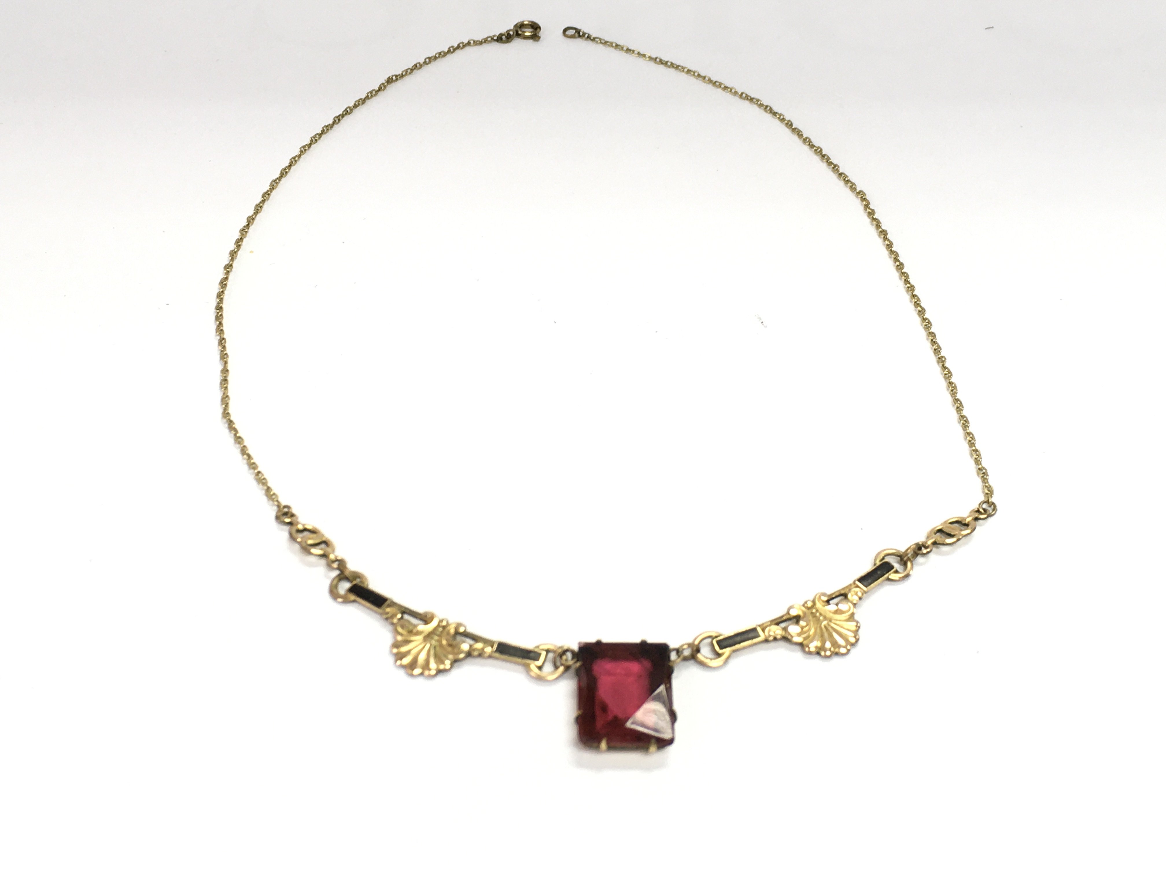 A gilt metal mourning necklace. Postage B