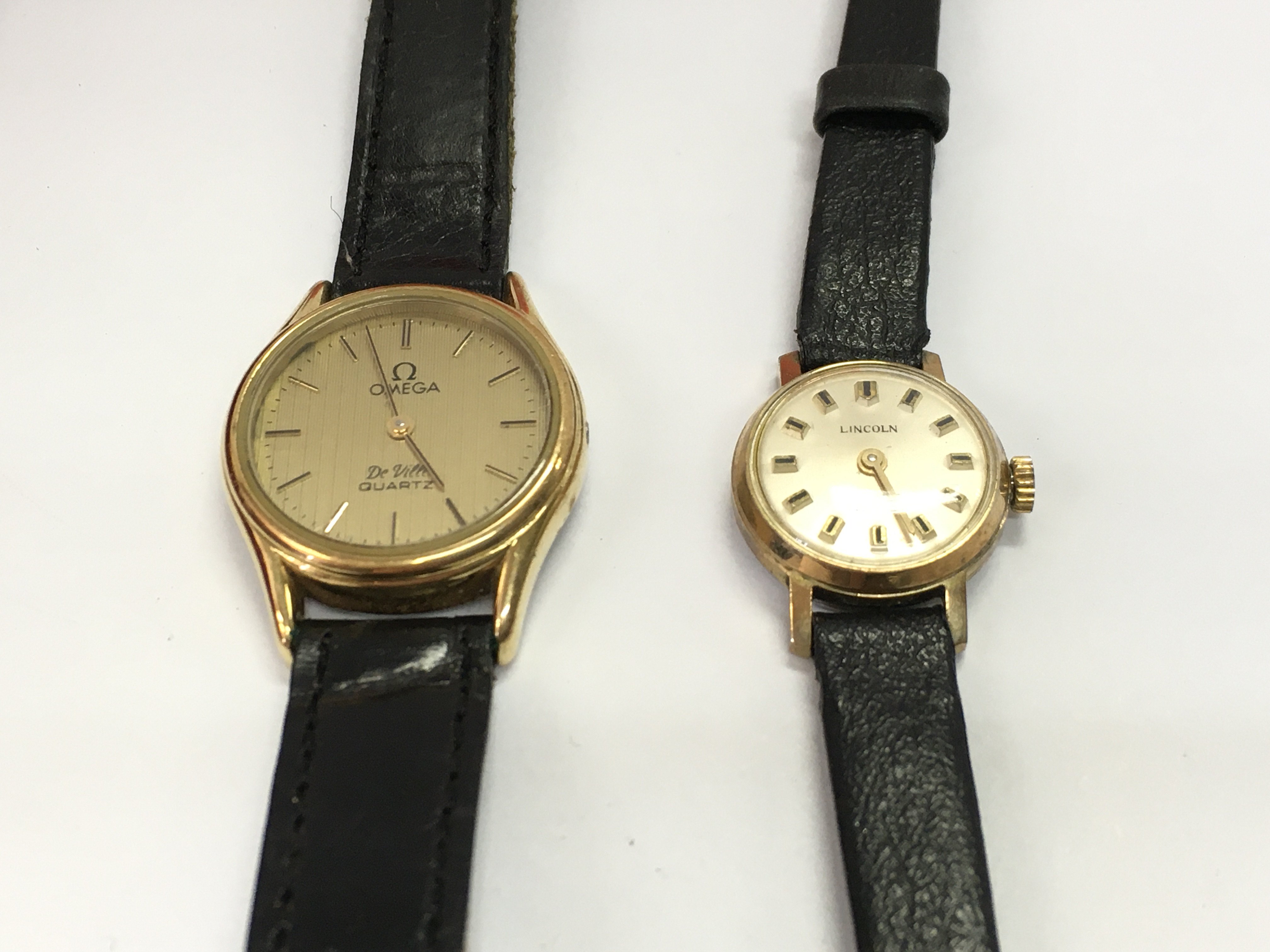 A ladies omega de ville quartz watch with box and one other vintage ladies wristwatch. Postage B