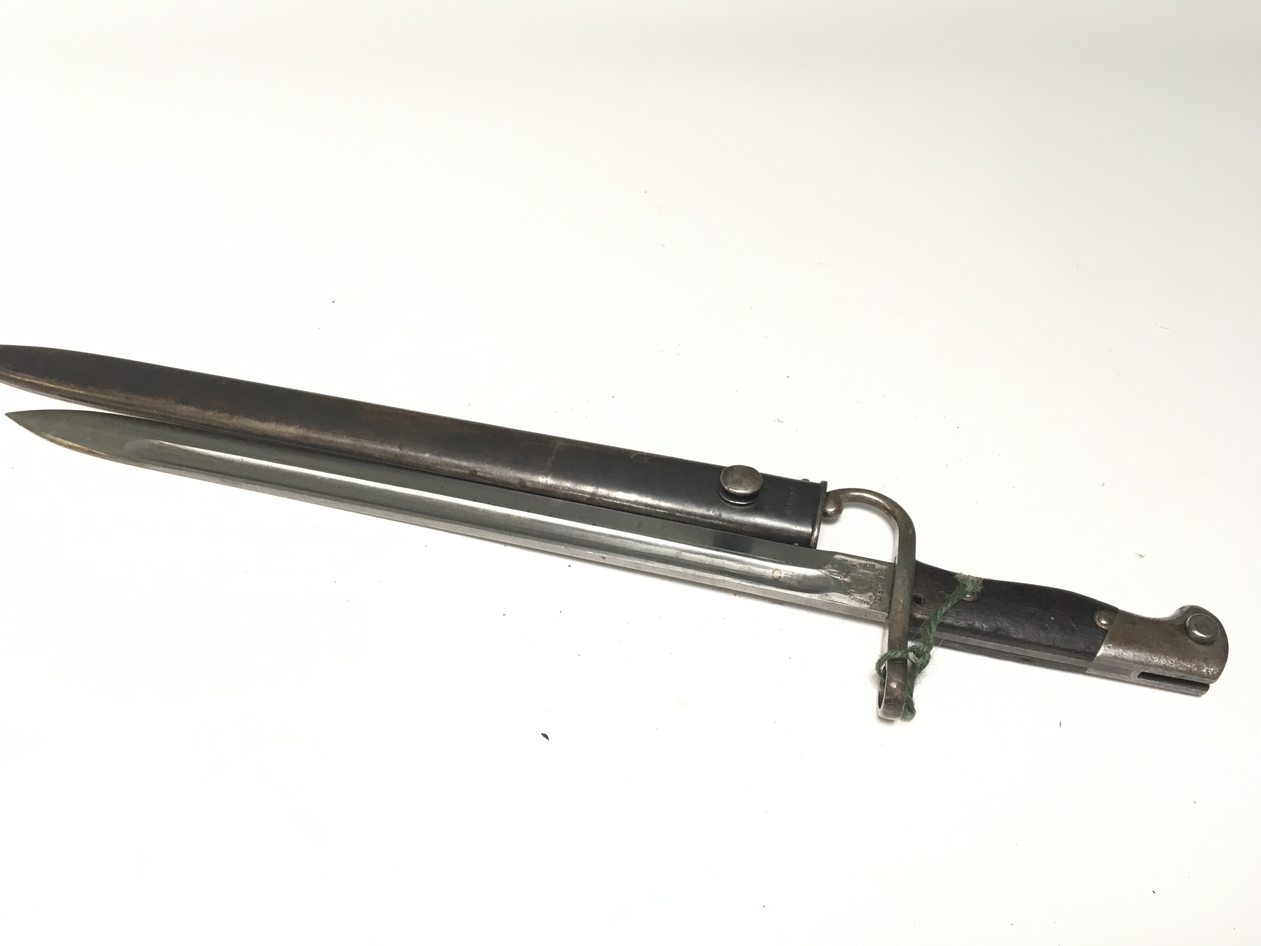 A good example of an Argentine 1909 bayonet with steel hook quilon steel scabbard matching serial number E8239 on blade and scabbard maker Weyersberg Kirschbaum & Co.