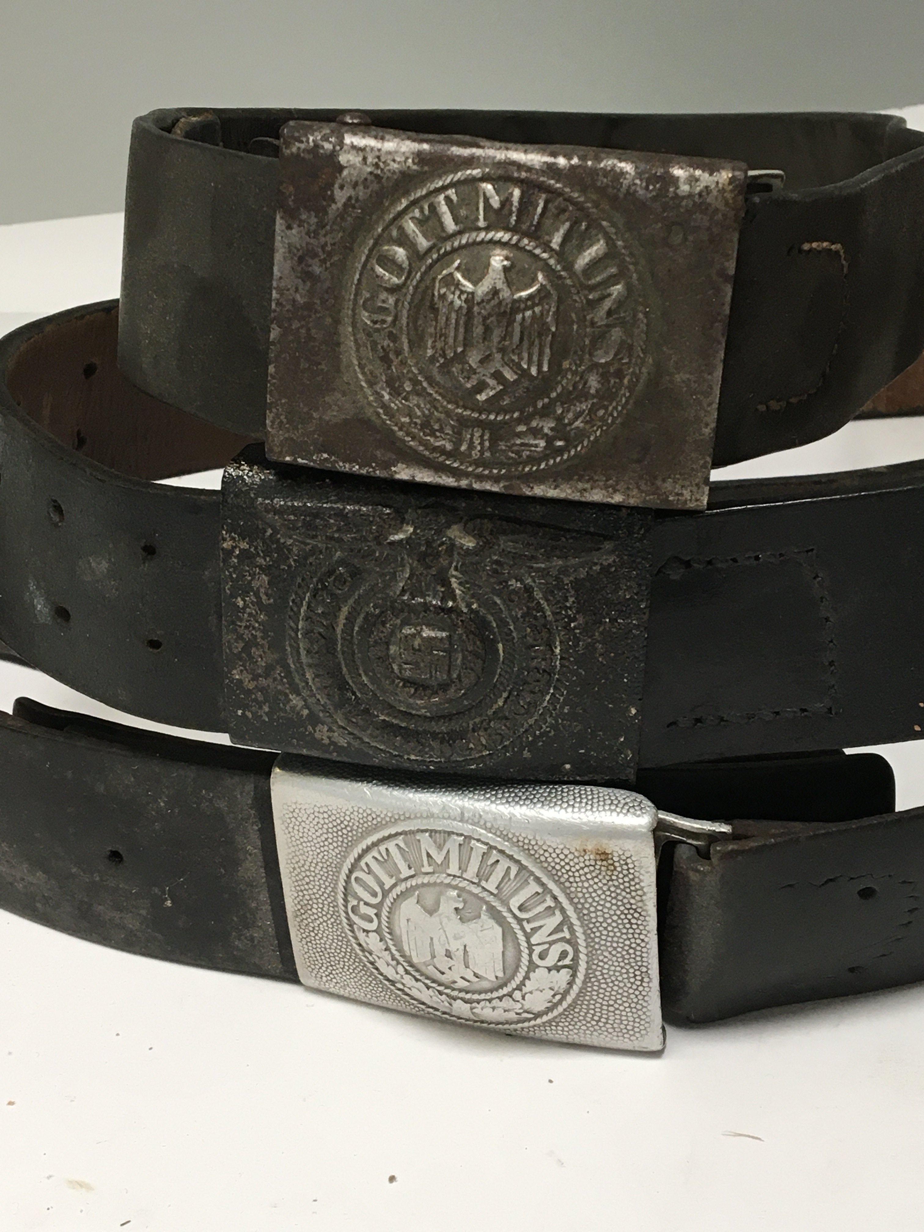 ThreeGerman Third Reich military issue belts with buckles one possible Hiltler Youth with the Eagle above Swastika with a laura. (3)