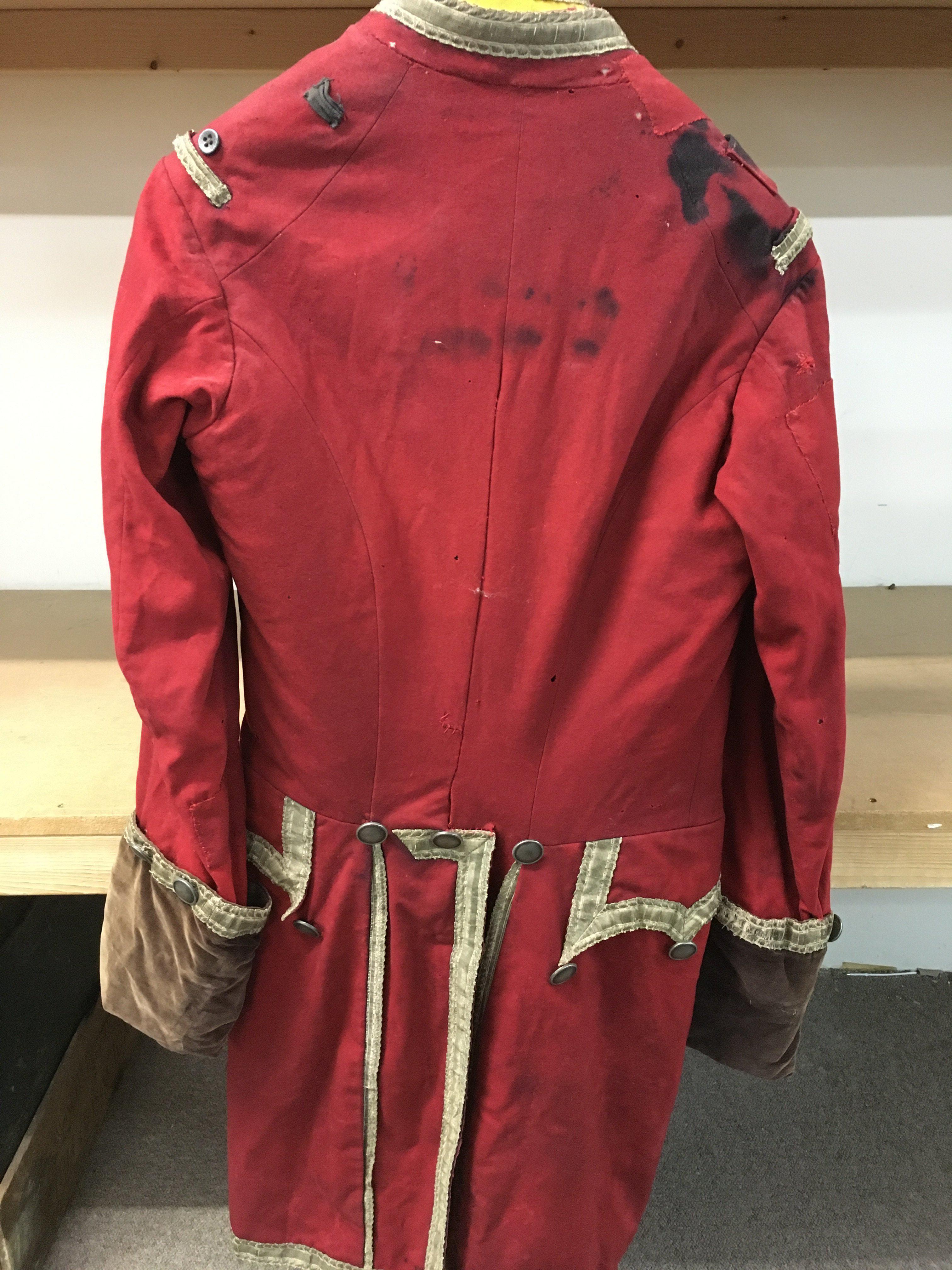 An 18th century red frock coat with waist coat. Postage category C