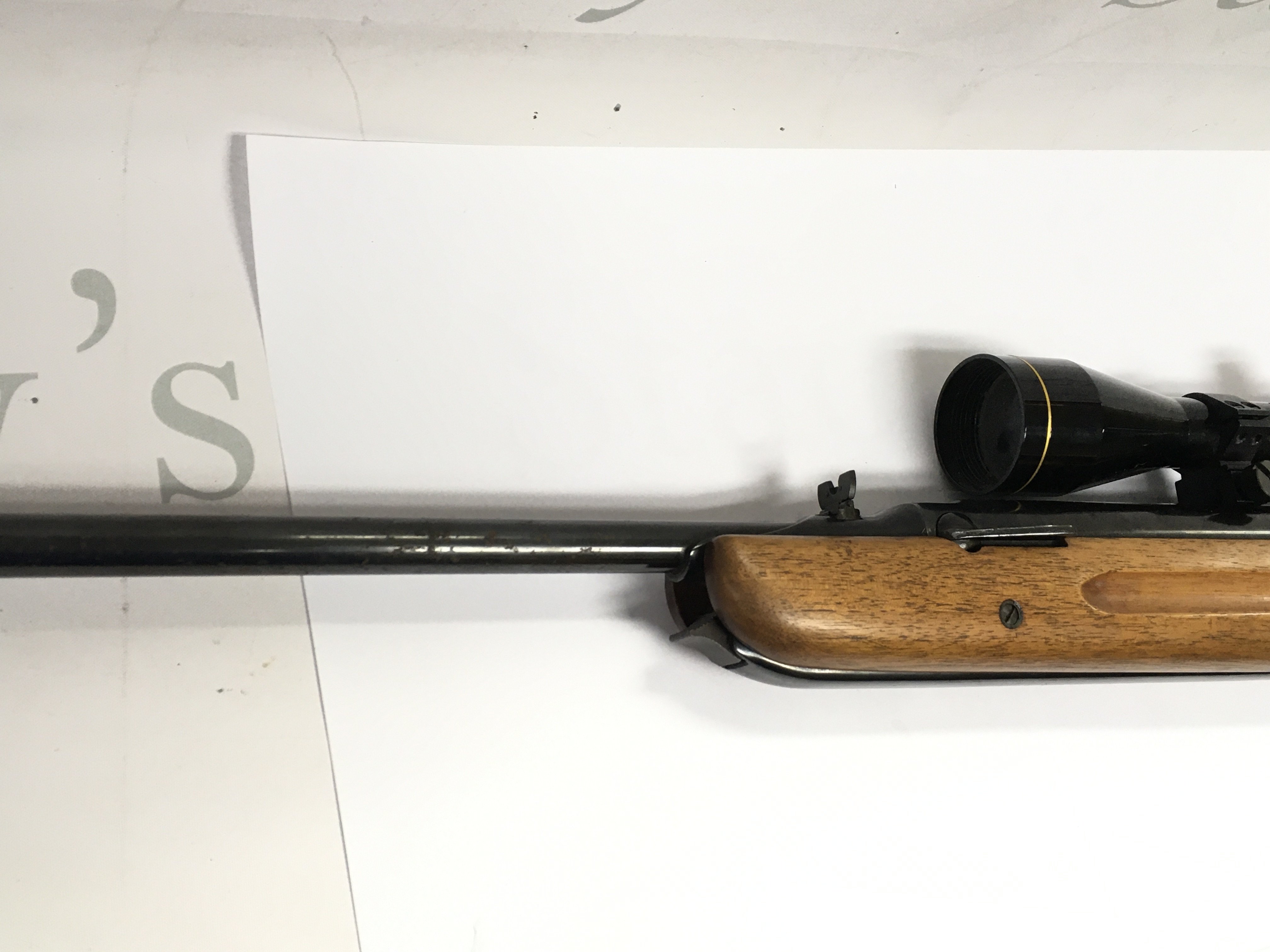 A .22 air rifle with mounted scope. 111cm overall length. Comes with slip.
