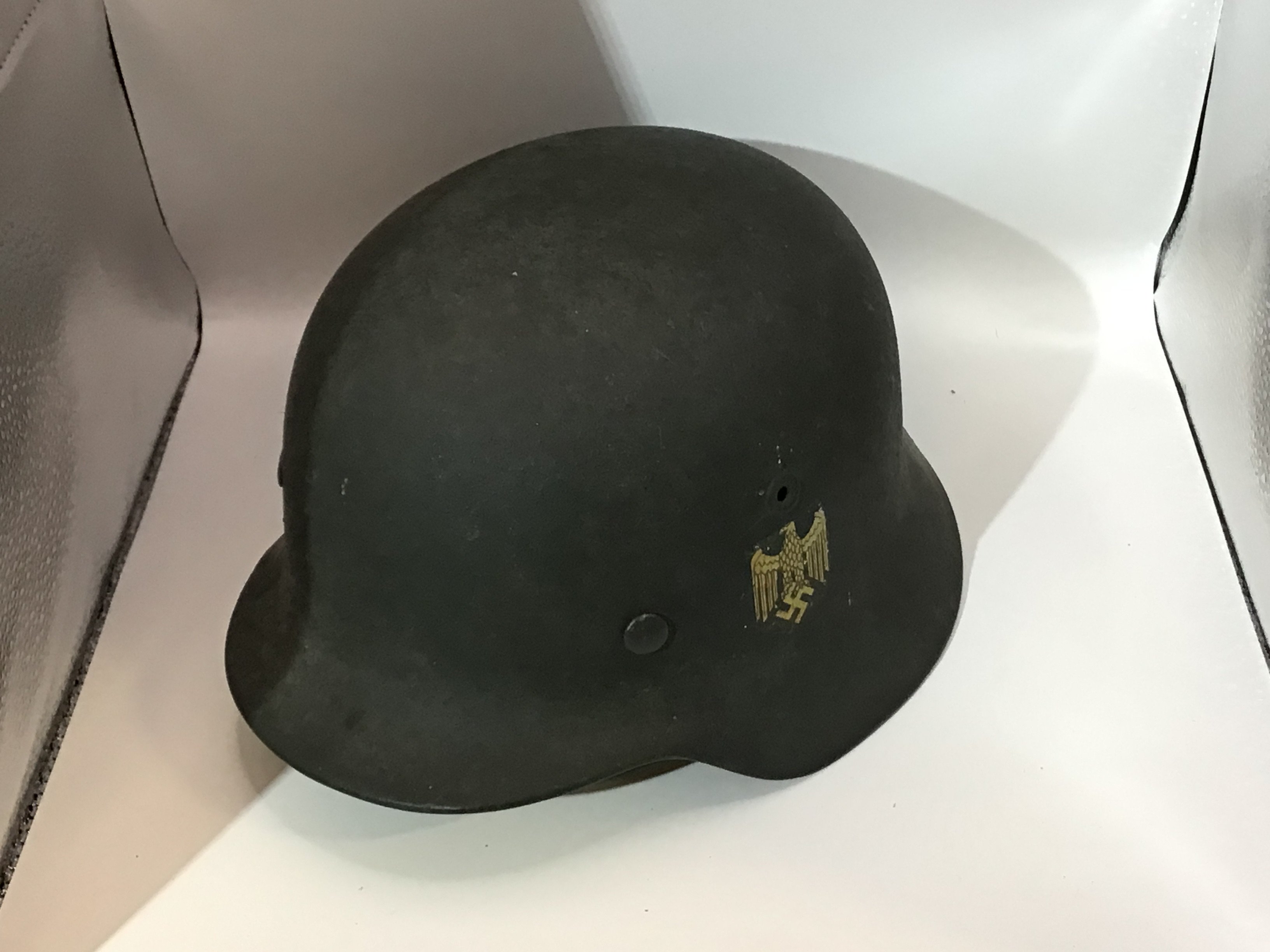 WW2 German Army (Heer) M35 Double Decal Steel Combat Helmet, fine example retaining much of the original apple green paint finish to the shell. Complete with original German army (heer) eagle decal and national tri-colour With leather liner and interior stamp mark FT64 and 440.