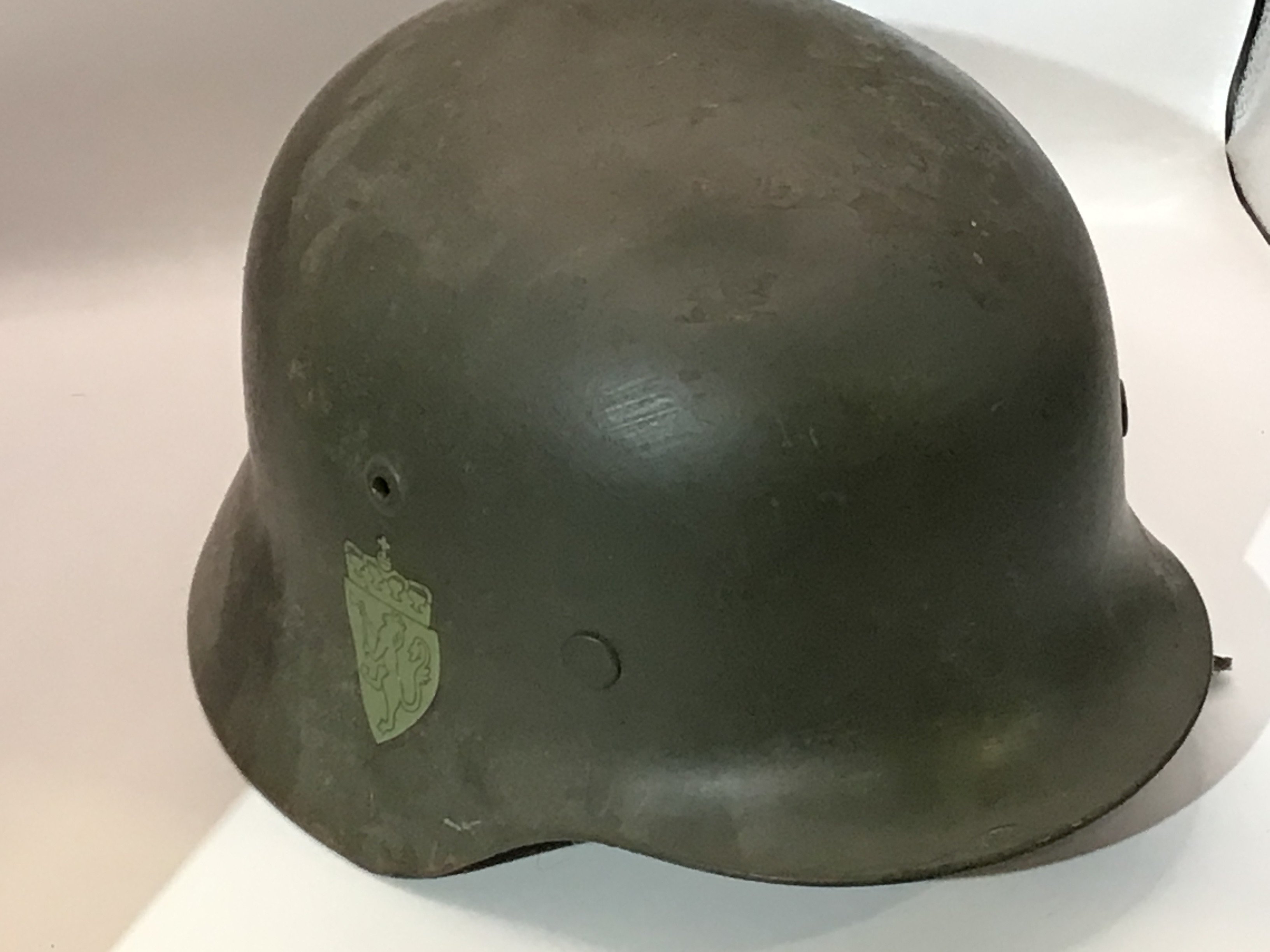 A very good example of a Norwegian II world war M38 pattern helmet with double Norwegian crest decal with leather liner.