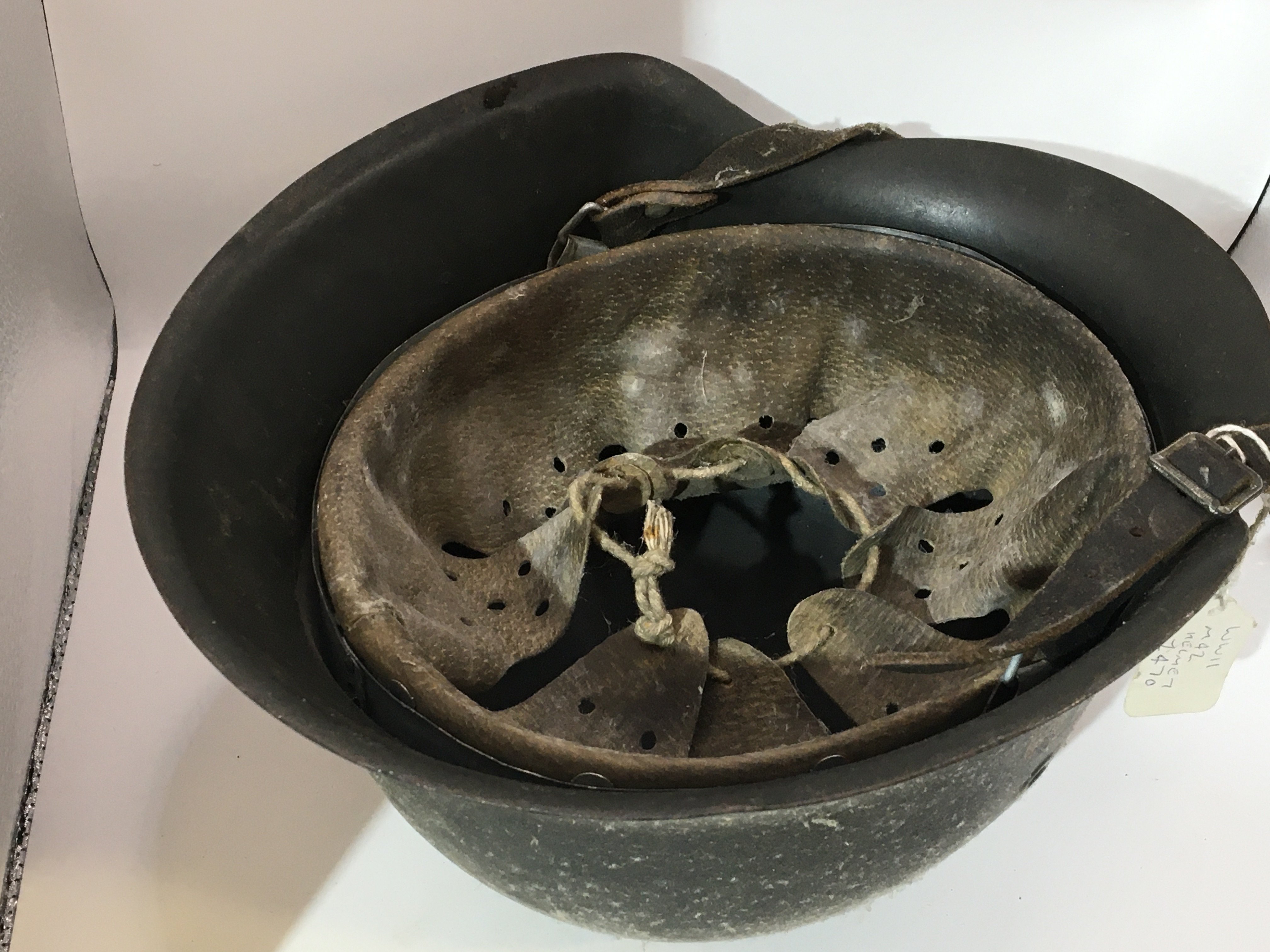 A German Third Reich steel helmet M42 pattern with single decal leather lining and interior edge stamp marks.