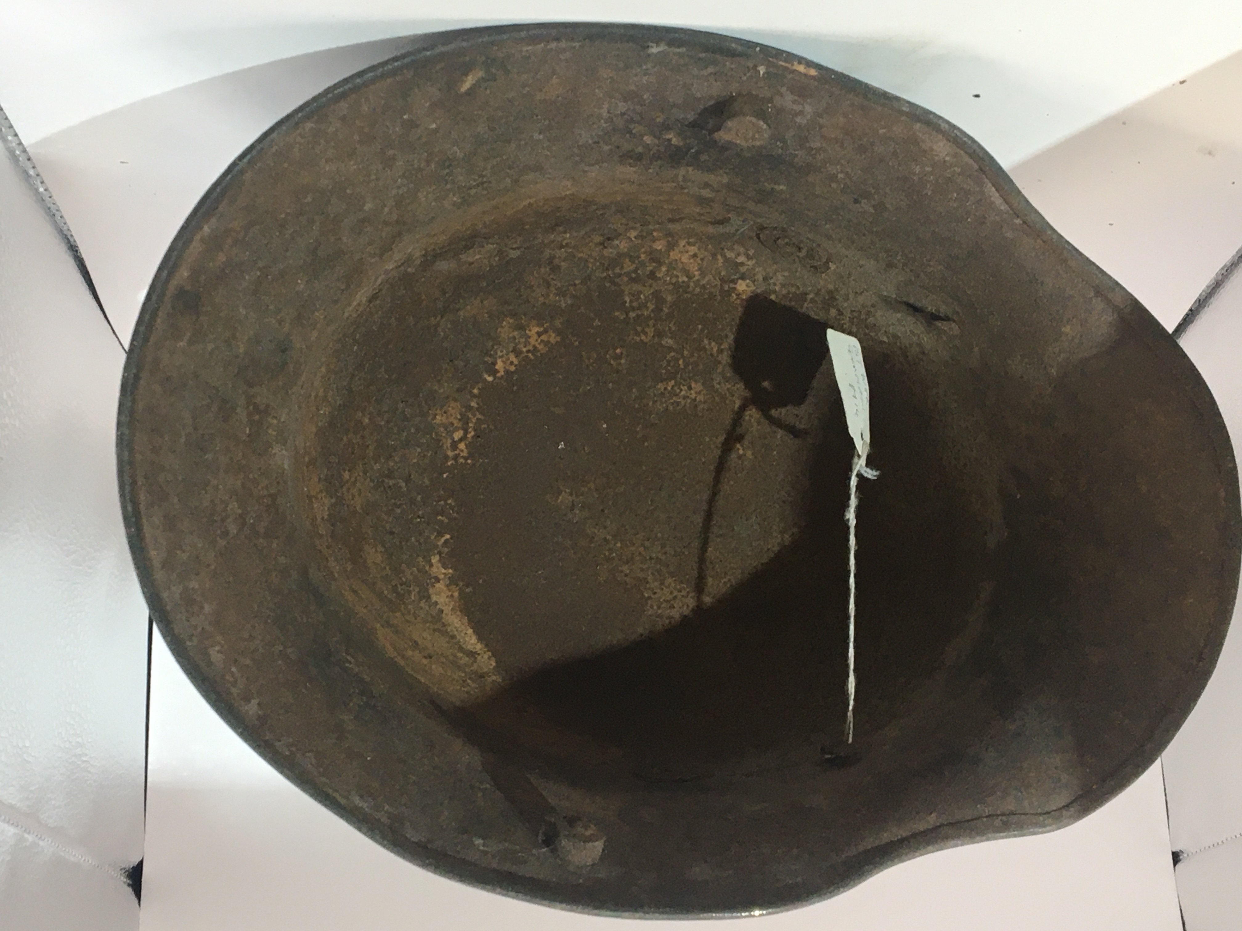 A German I world war M16 pattern helmet original green colour with scuffs repressing use in the battle field no liner.