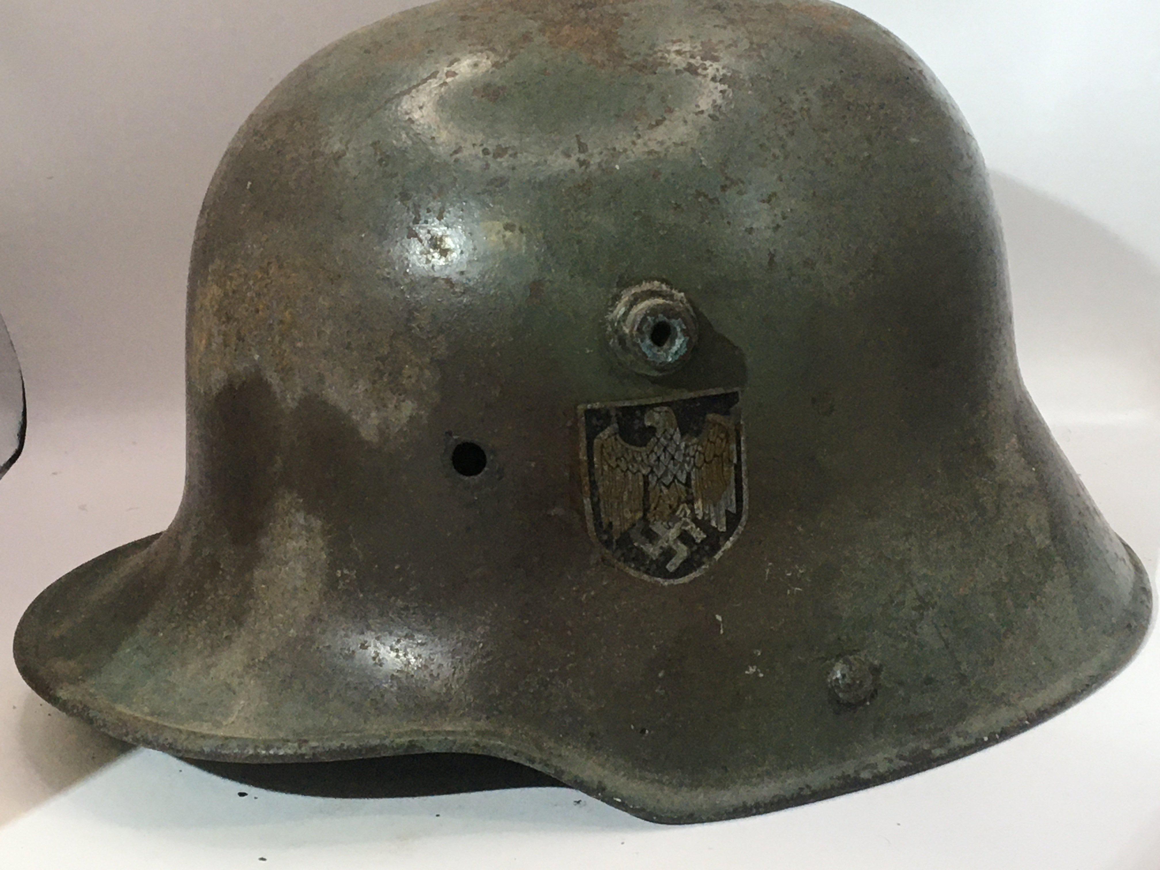 An interesting and possible rare transitional German Steel helmet M17 pattern with two decal to the side possible original. No liner.