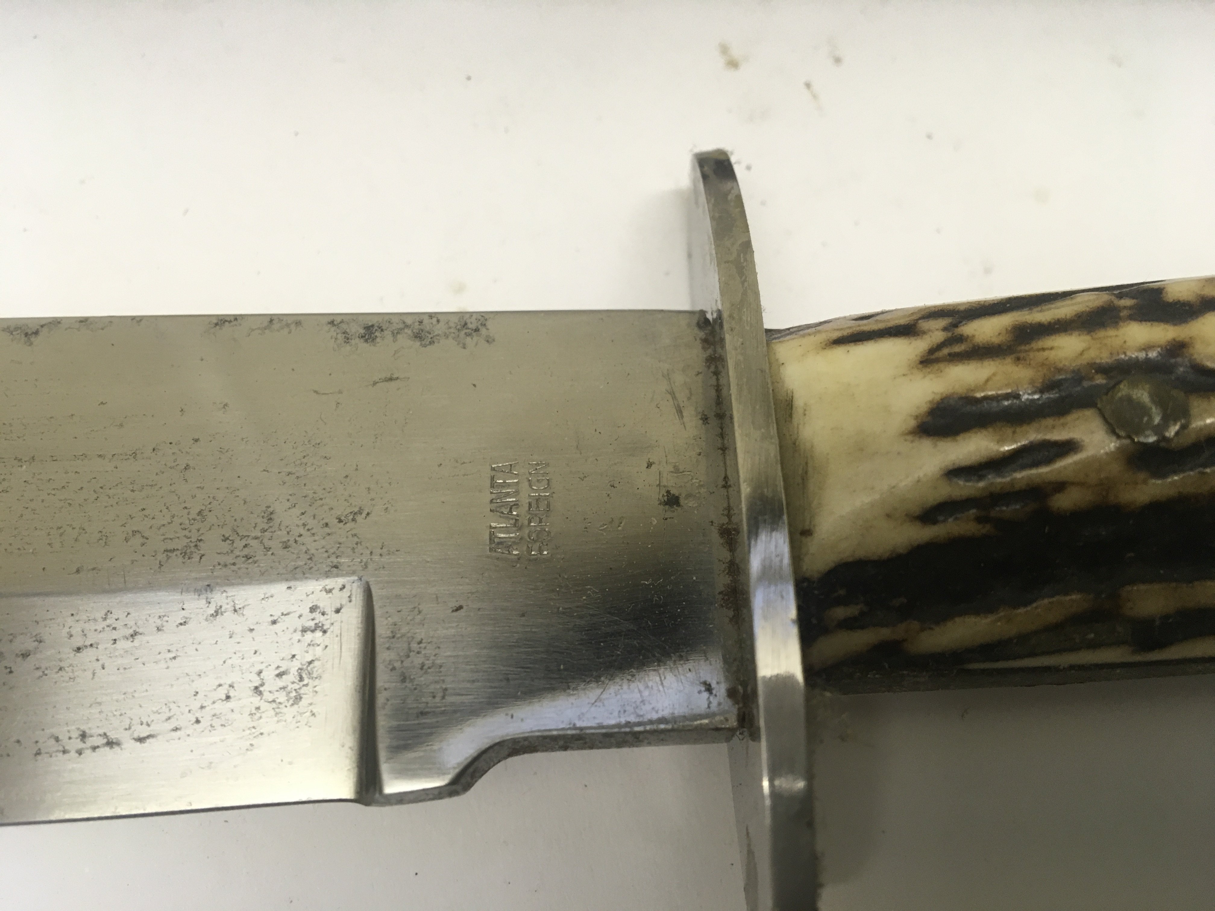 A Vintage Hunting Bowie Knife with a horn handle grip the blade stamped Original Bowie Knife with makers marks and leather embossed scabbard. NO RESERVE