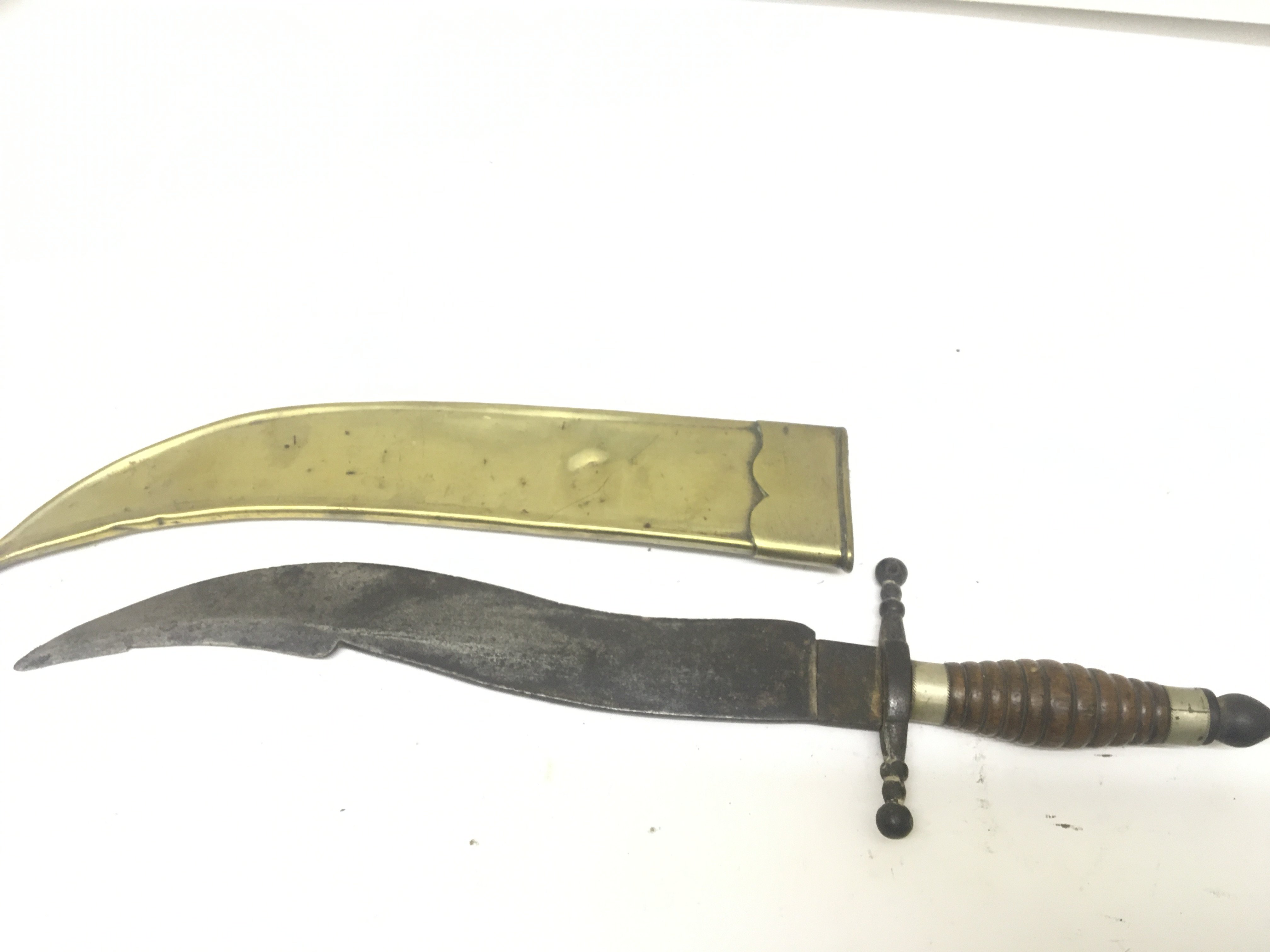 An Antique Knife with steel blade of Kris type with a turned wood grip and brass scabbard. length 45cm. NO RESERVE