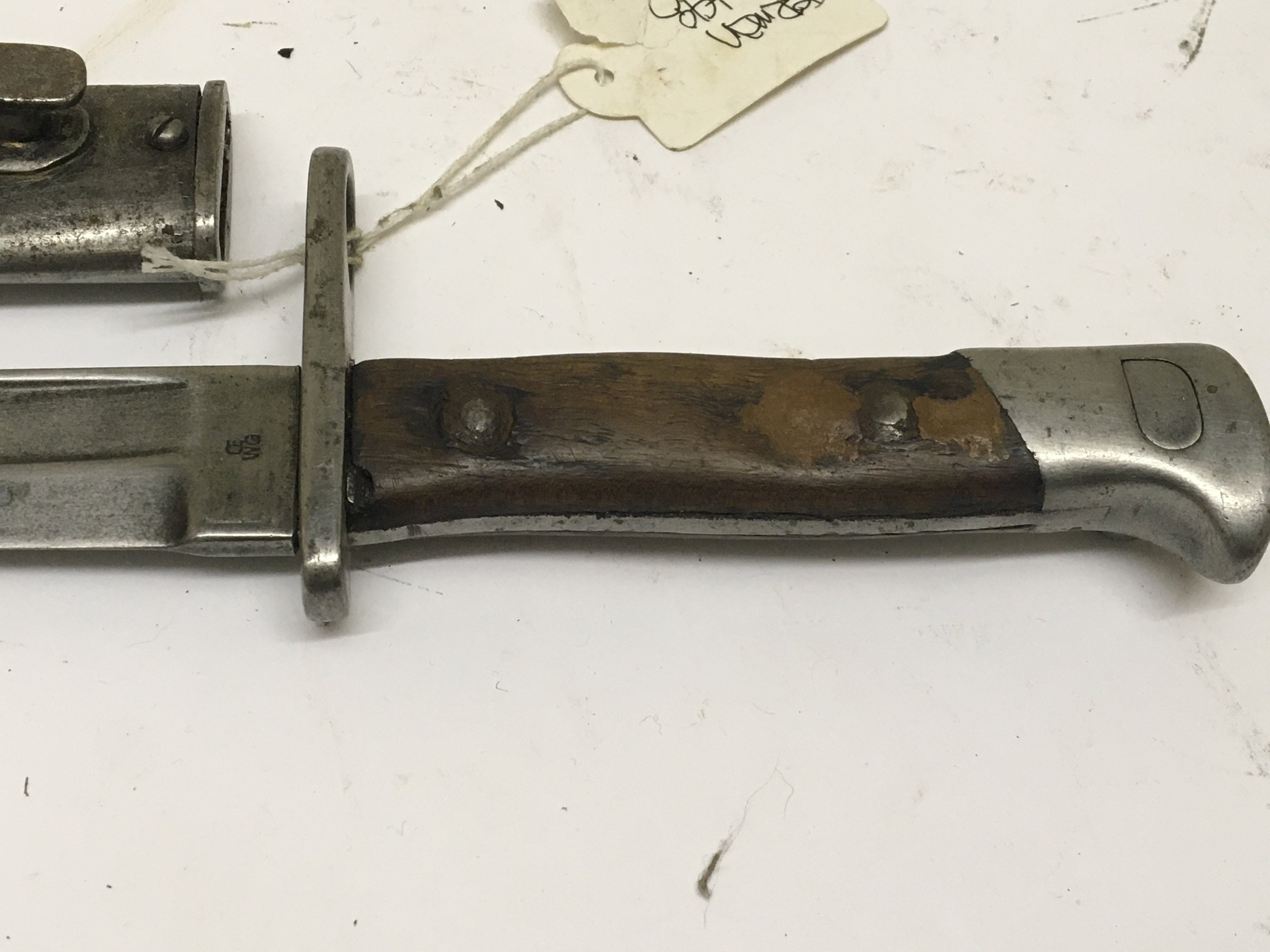 A German K98 Mauser bayonet with wood grip the blade with makers stamp. Length 39cm. NO RESERVE