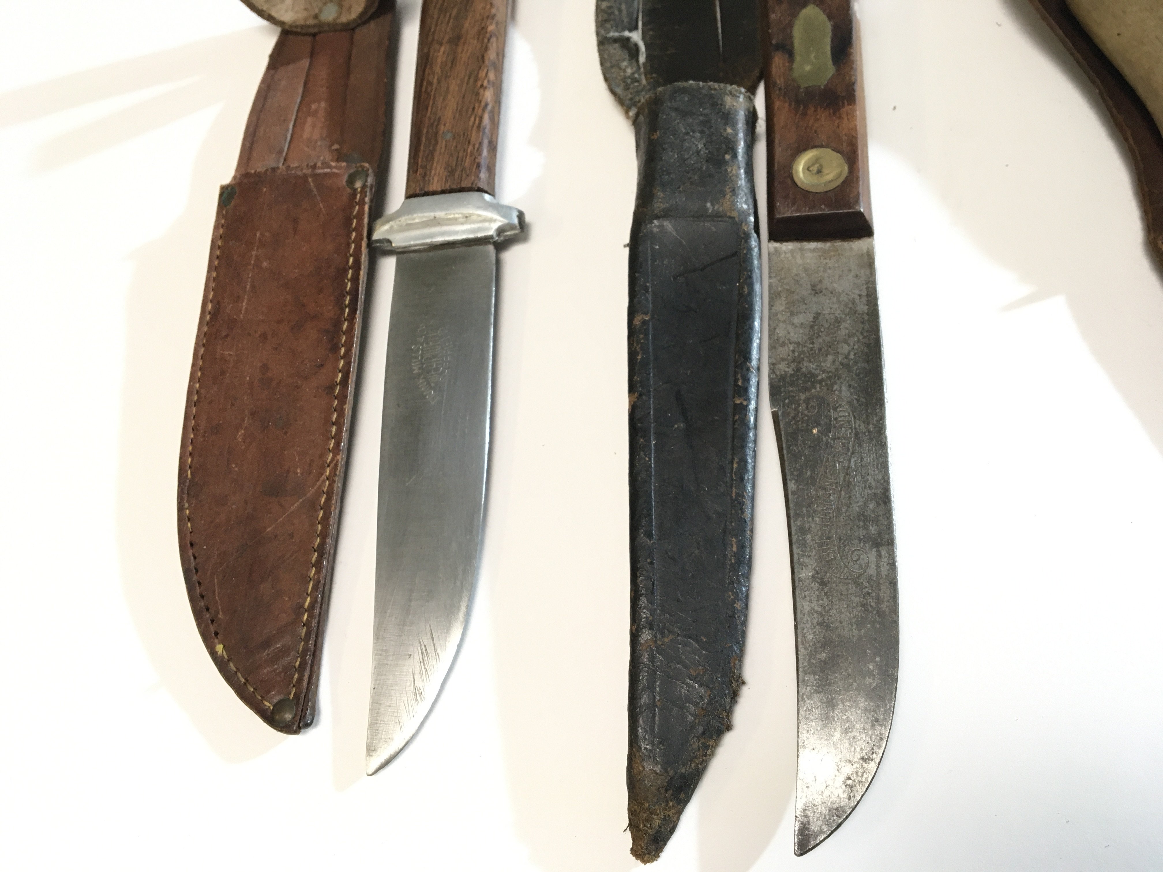 A collection of Vintage hunting knives The Bushmans Friend maker Maleham & Yeomans Sheffield a Frank Mills fighting knife and three other. (5)